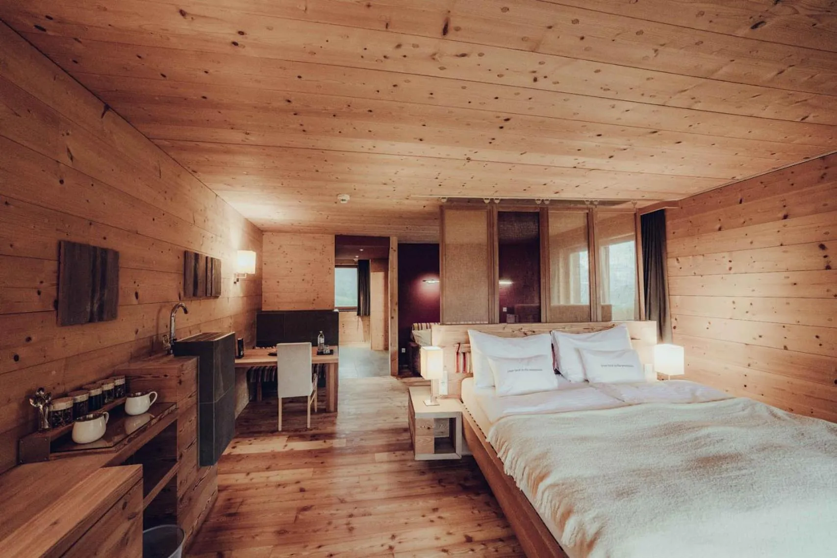 Bed in Holzhotel Forsthofalm