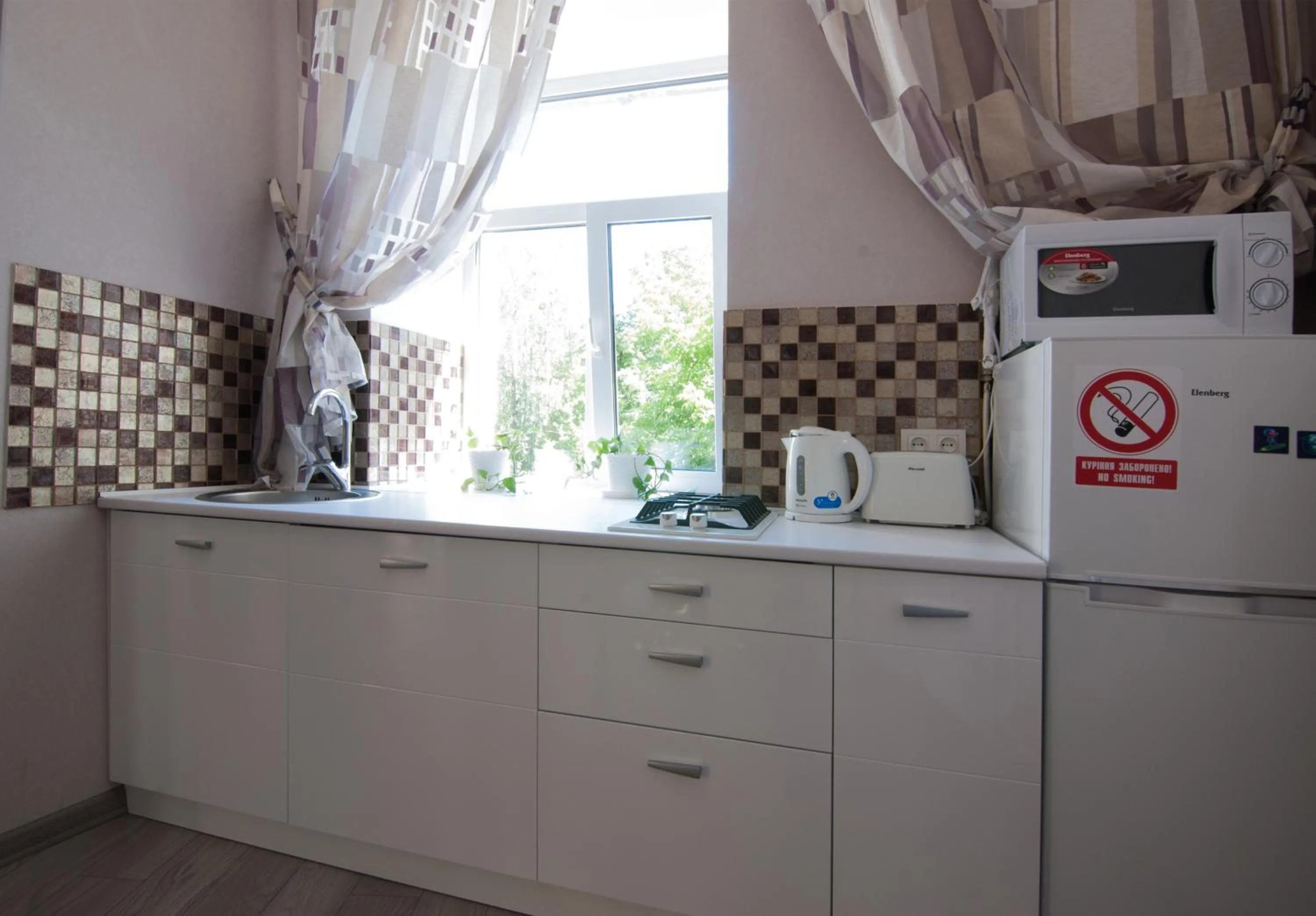 Kitchen or kitchenette in Home Hotel Apartments on Mykhailivska Square - Kiev