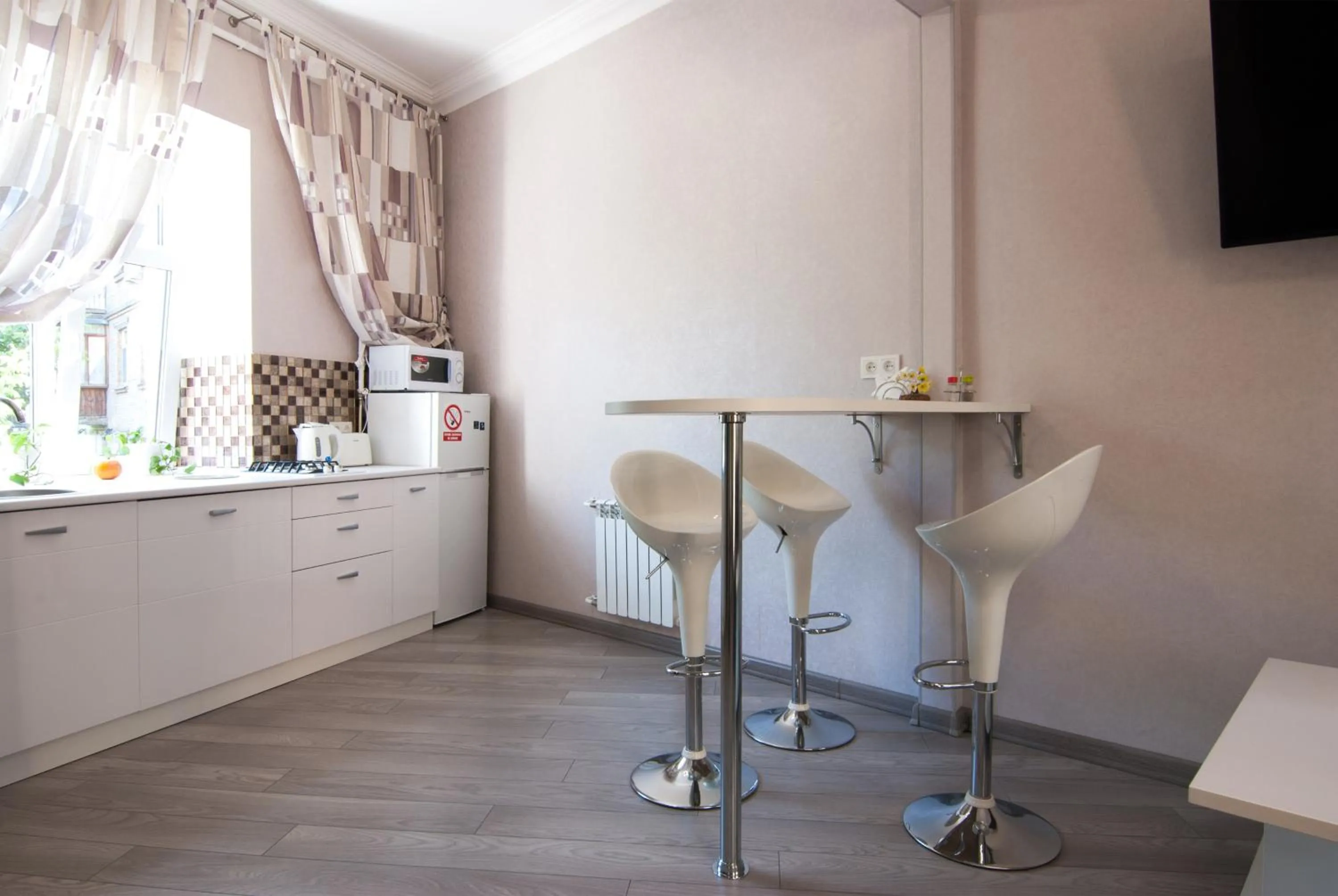 Kitchen or kitchenette in Home Hotel Apartments on Mykhailivska Square - Kiev
