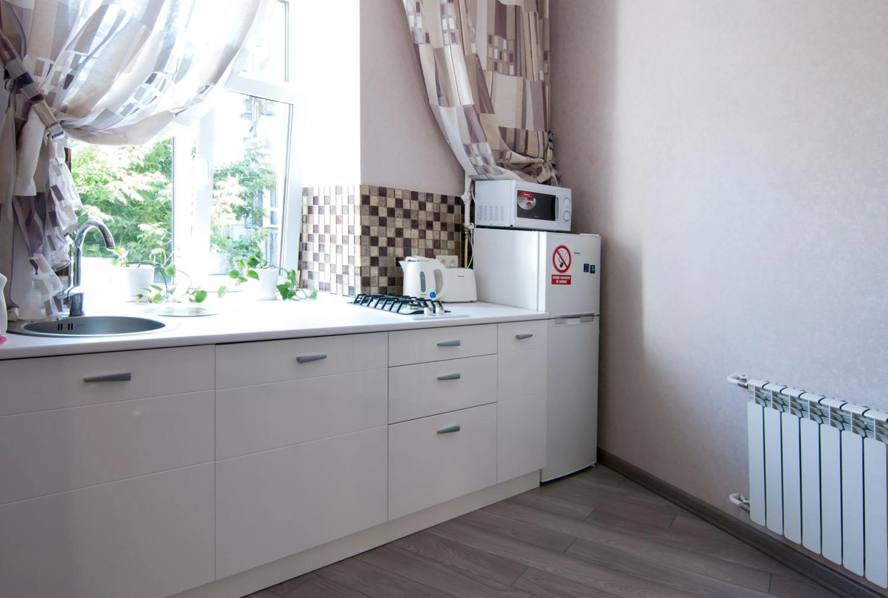 Kitchen or kitchenette in Home Hotel Apartments on Mykhailivska Square - Kiev