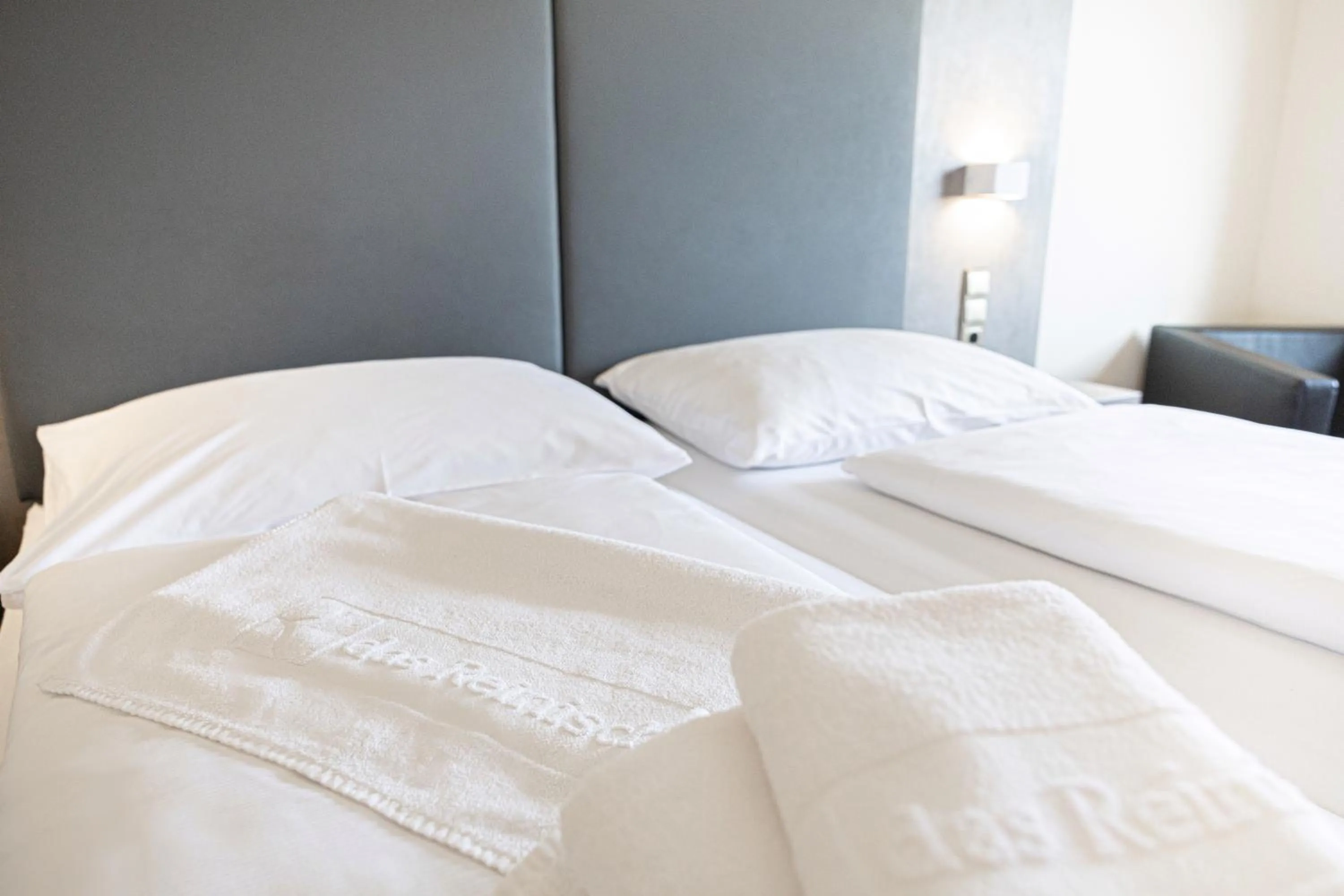 Bed in Das Reinisch Just Rooms