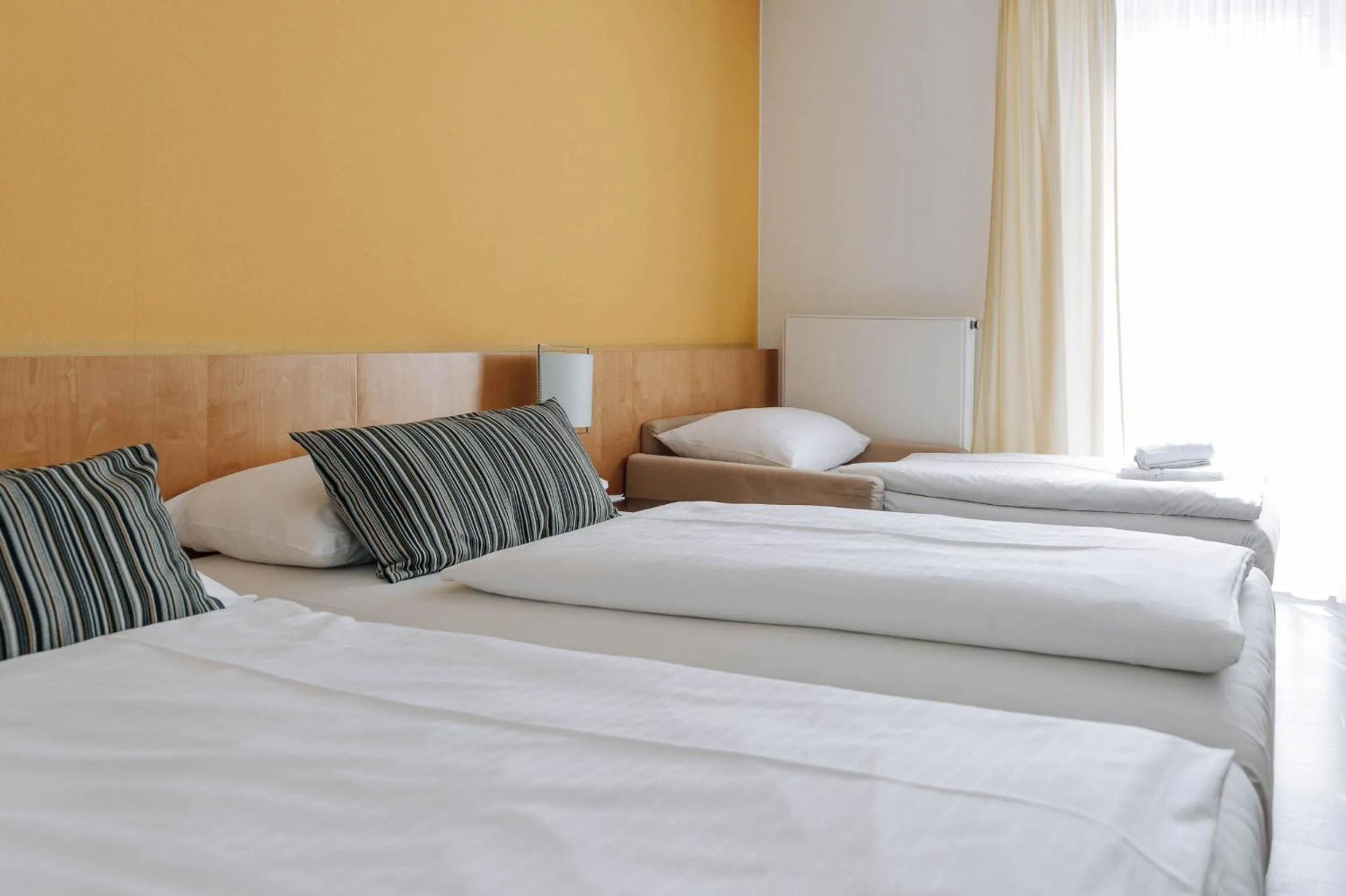 Photo of the whole room, Bed in HEINhotel vienna airport