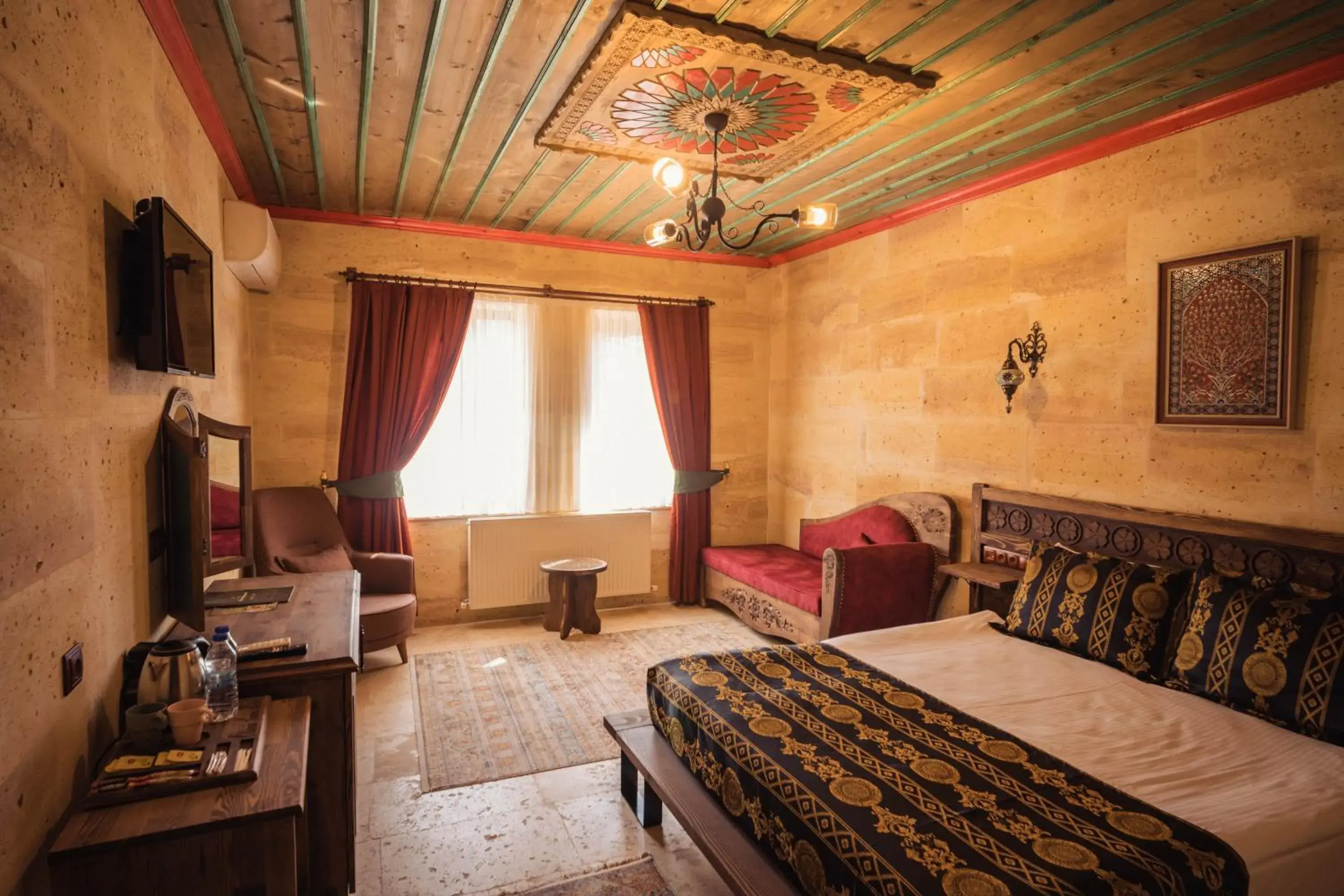 Communal lounge/ TV room, Bed in Olivia Cave Hotel Communal lounge/ TV room, Bed in Olivia Cave Hotel