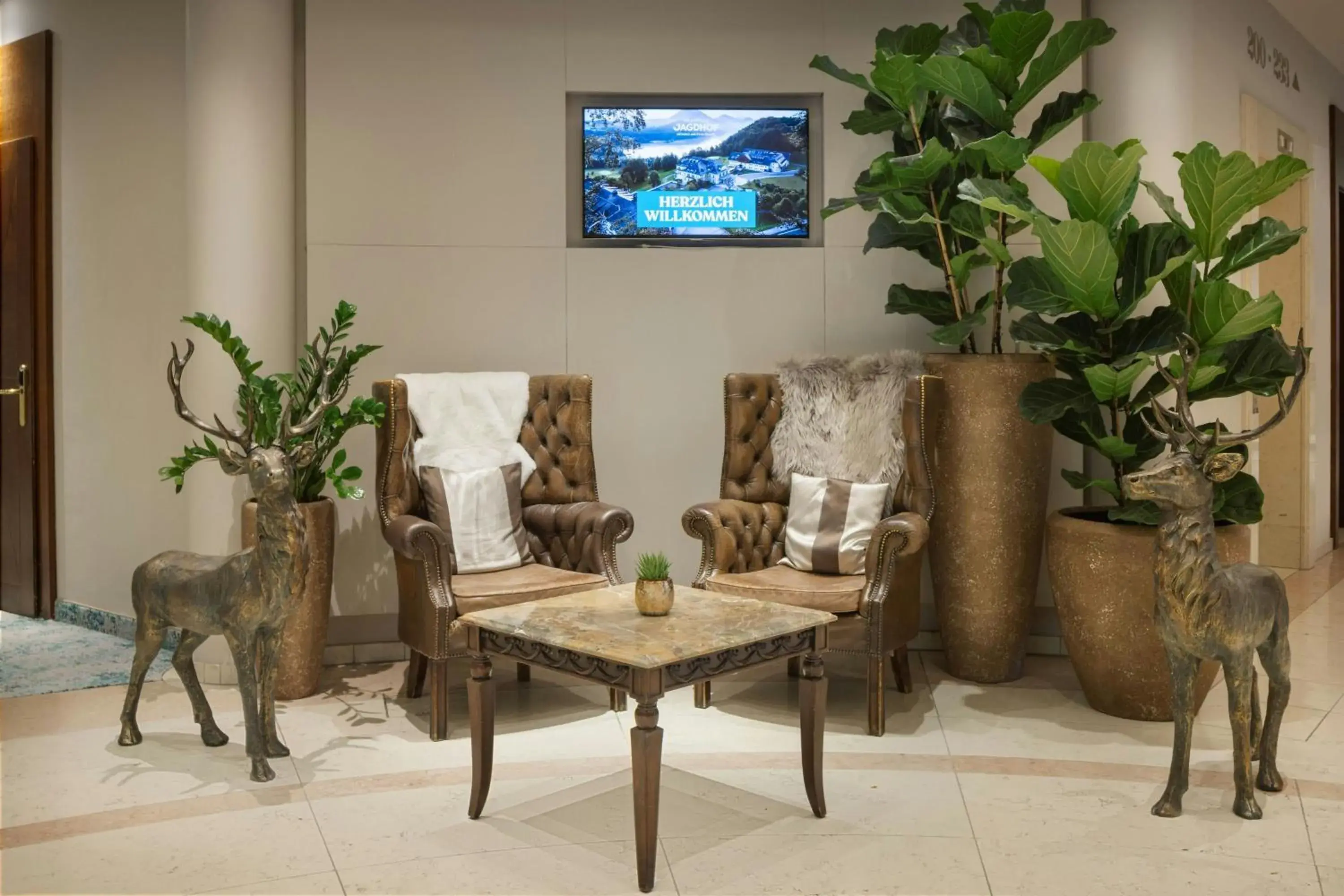 Lobby or reception in Arabella Jagdhof Resort am Fuschlsee, a Tribute Portfolio Hotel Lobby or reception in Arabella Jagdhof Resort am Fuschlsee, a Tribute Portfolio Hotel