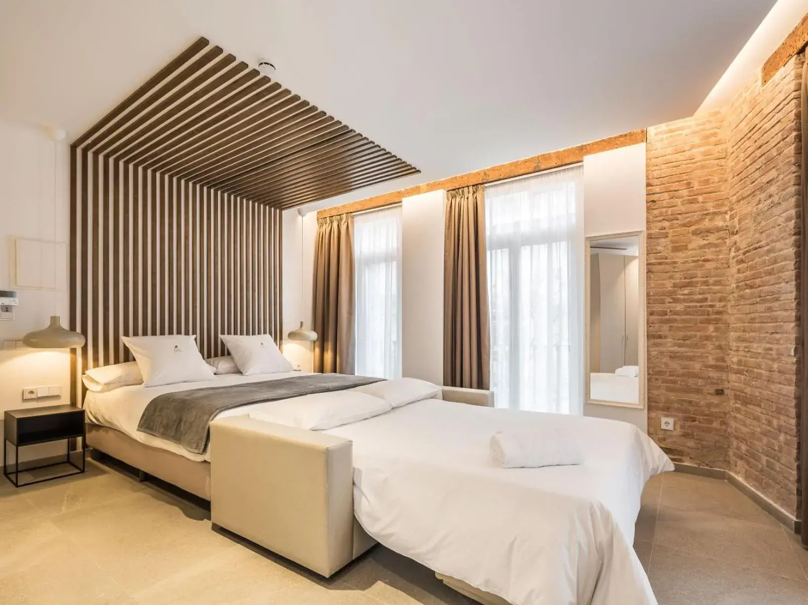 Bed in Mon Suites Benlliure Bed in Mon Suites Benlliure