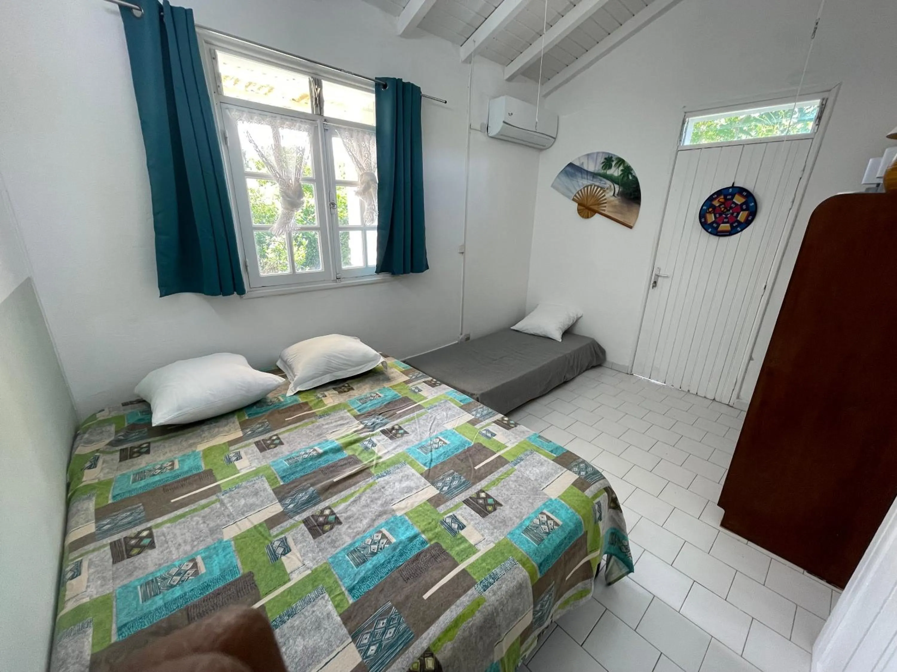 Bed in La villa les palmiers simplicité convivialité