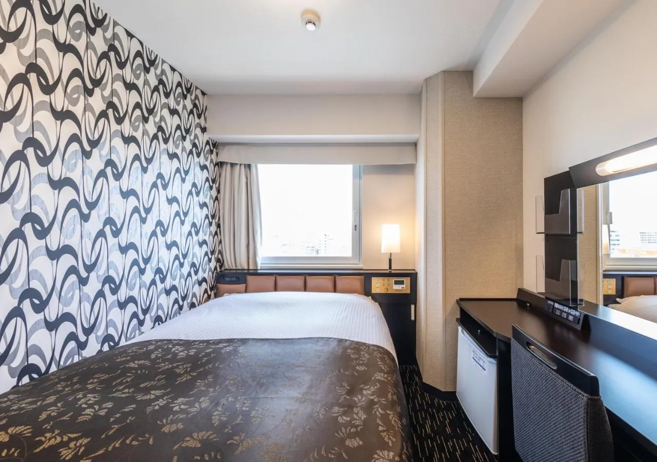 Photo of the whole room, Bed in APA Hotel Hakataeki Chikushiguchi