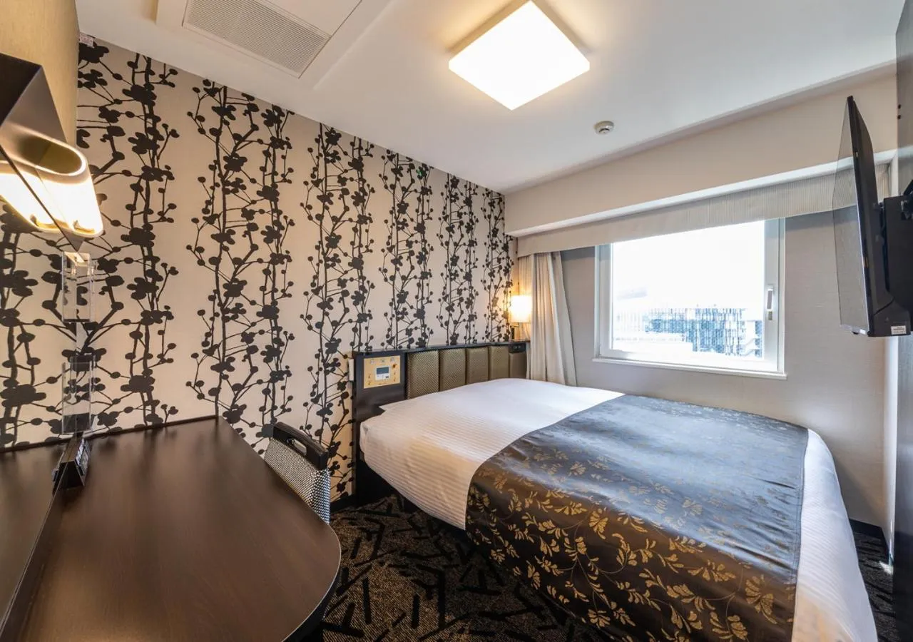 Photo of the whole room, Bed in APA Hotel Hakataeki Chikushiguchi