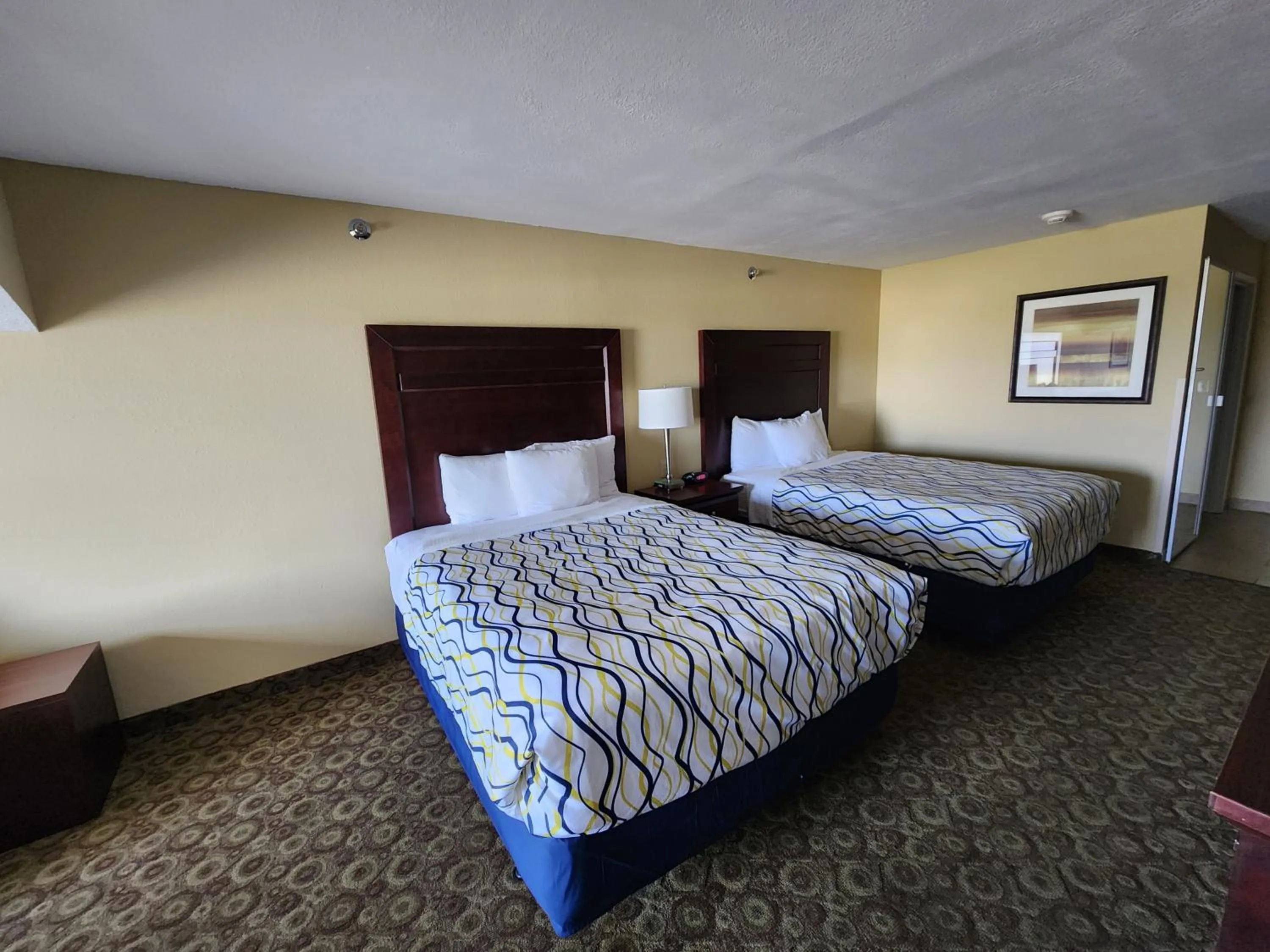 Bed in Highland Suites Minot