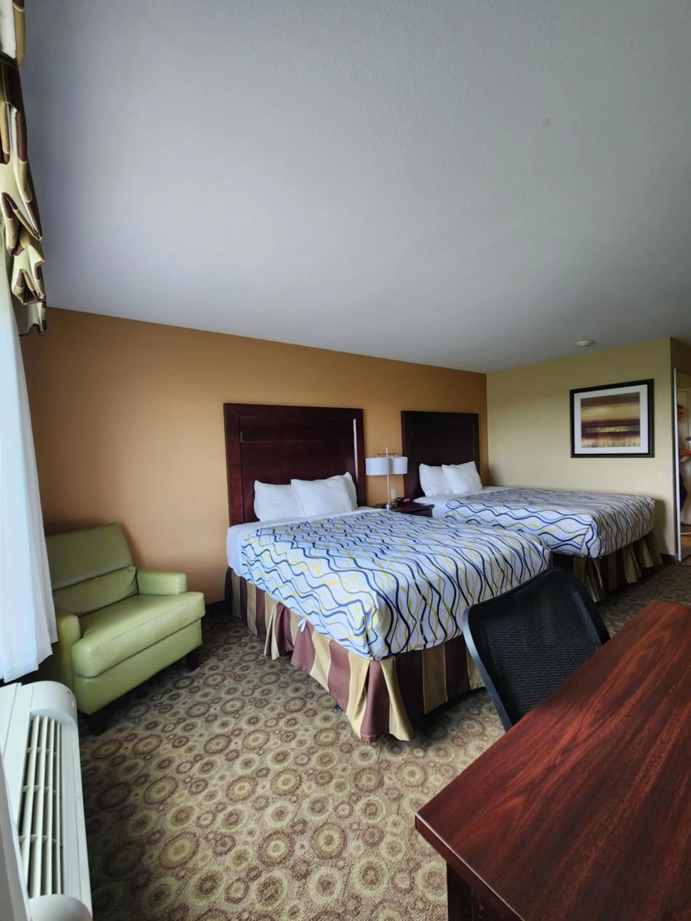 Bed in Highland Suites Minot