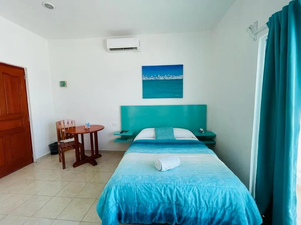 Seating area, Bed in Habitación Amanecer Turquesa #5