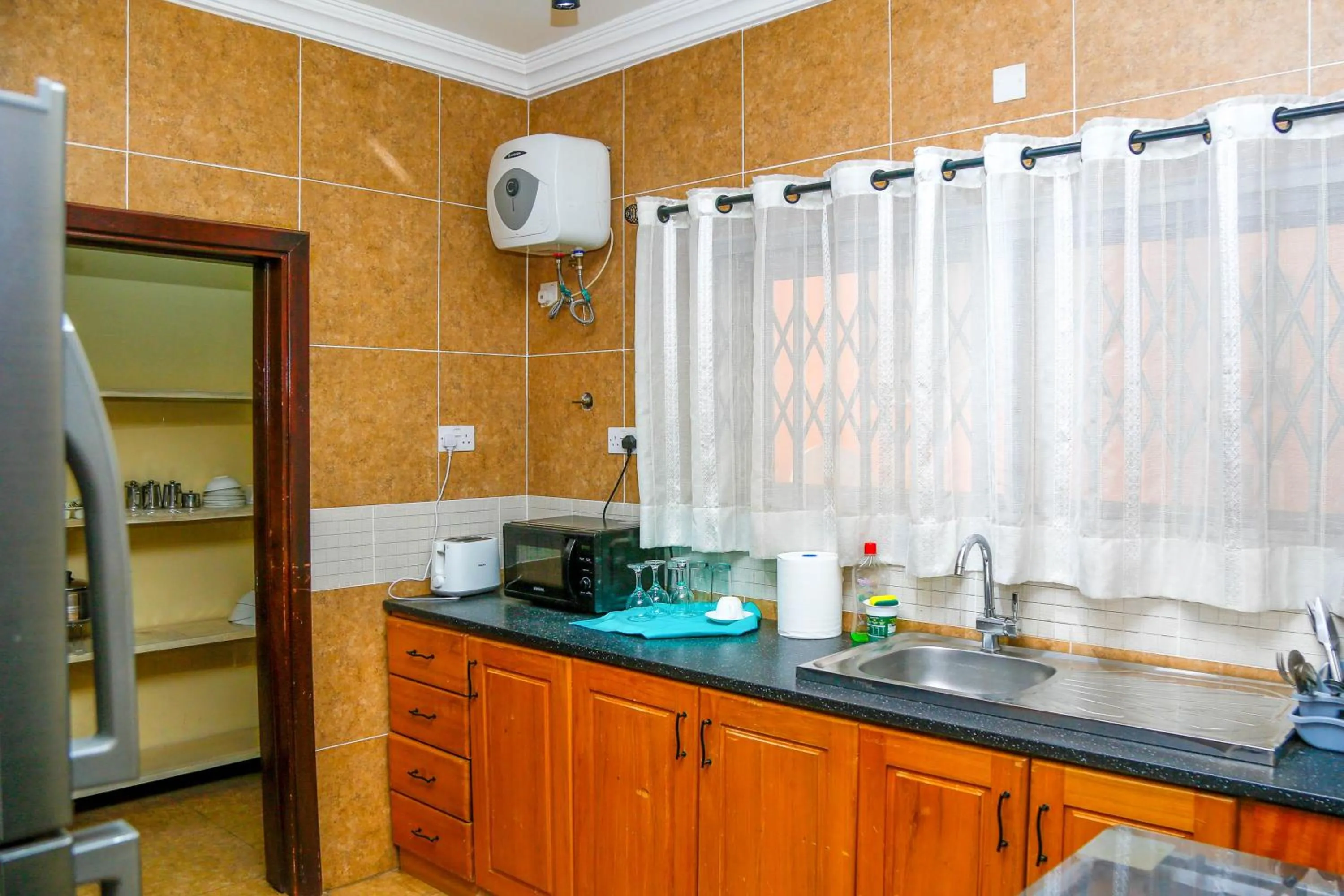 Kitchen or kitchenette in Midindi Hotel