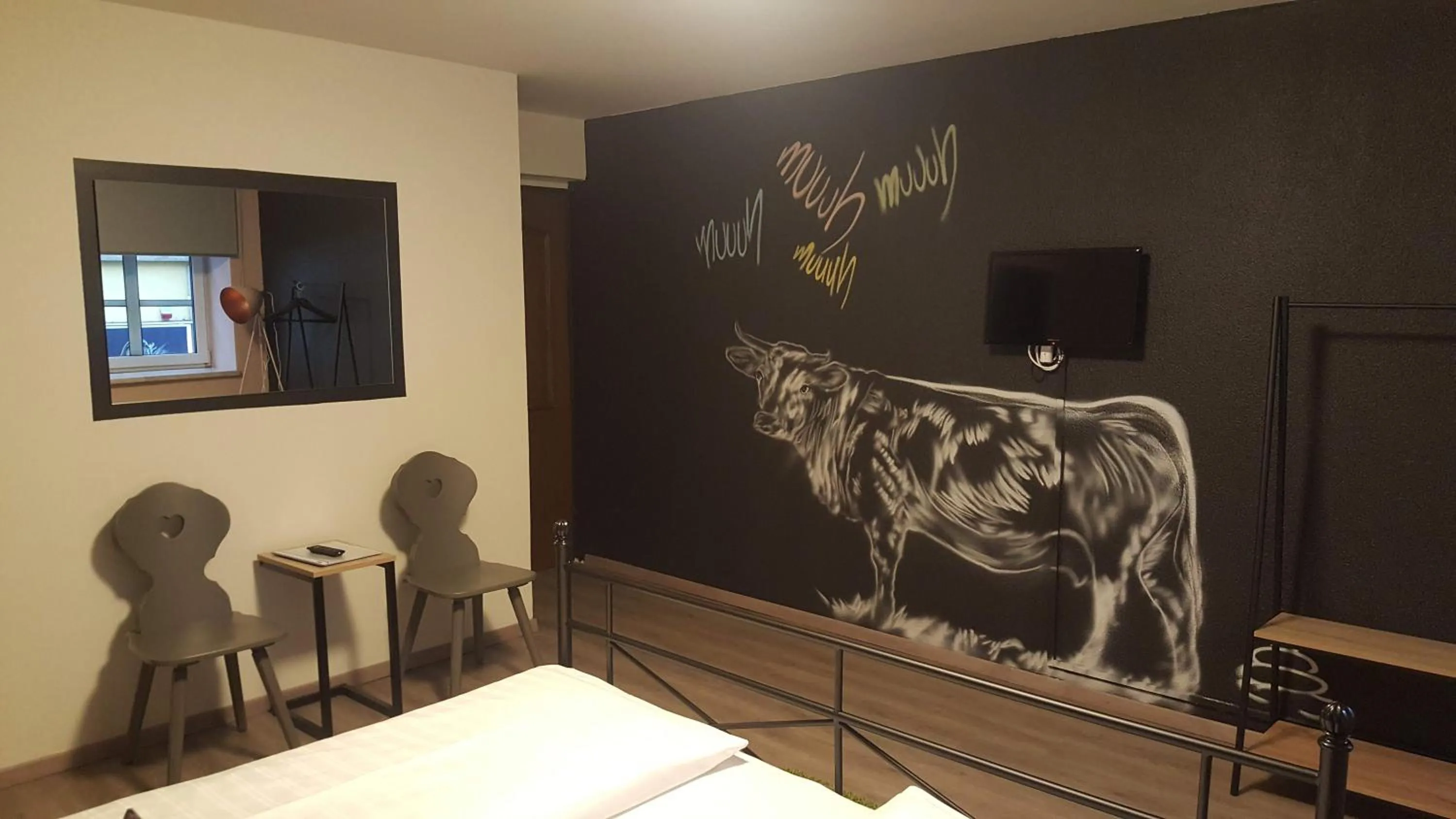 Photo of the whole room, Bed in Mama Muh Self-Check-in