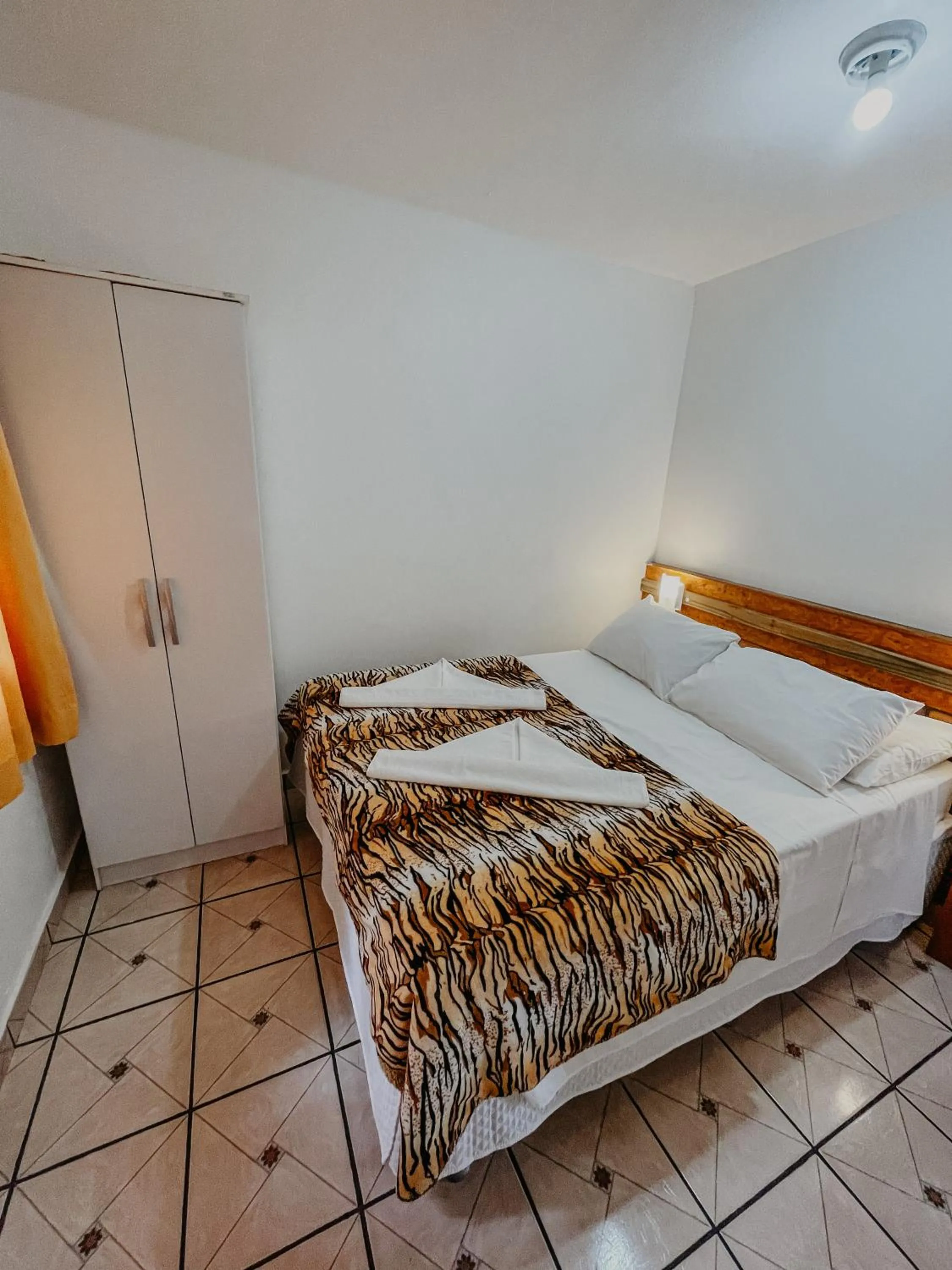 Bed in Pousada Praia de Bombinhas