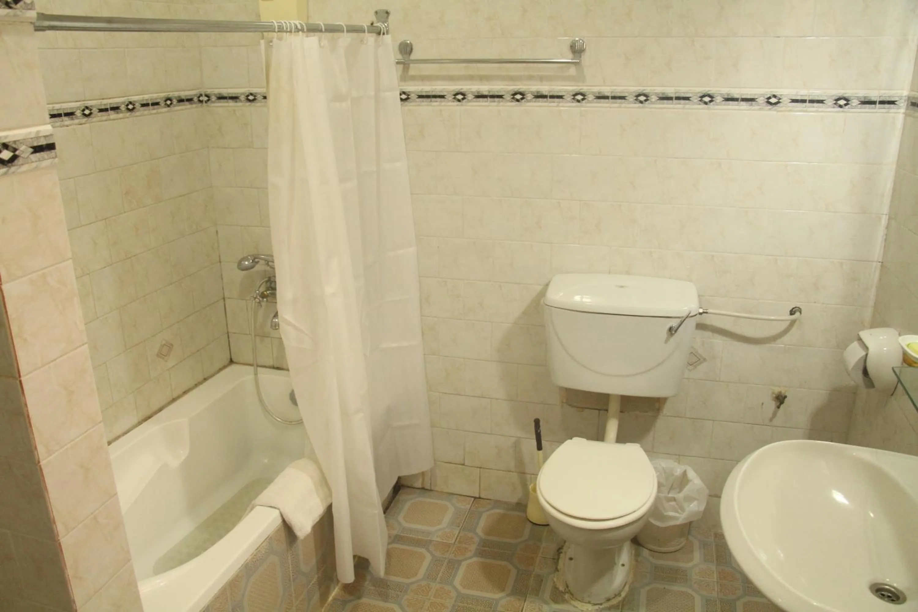 Toilet in Hill View Hotel West Airport