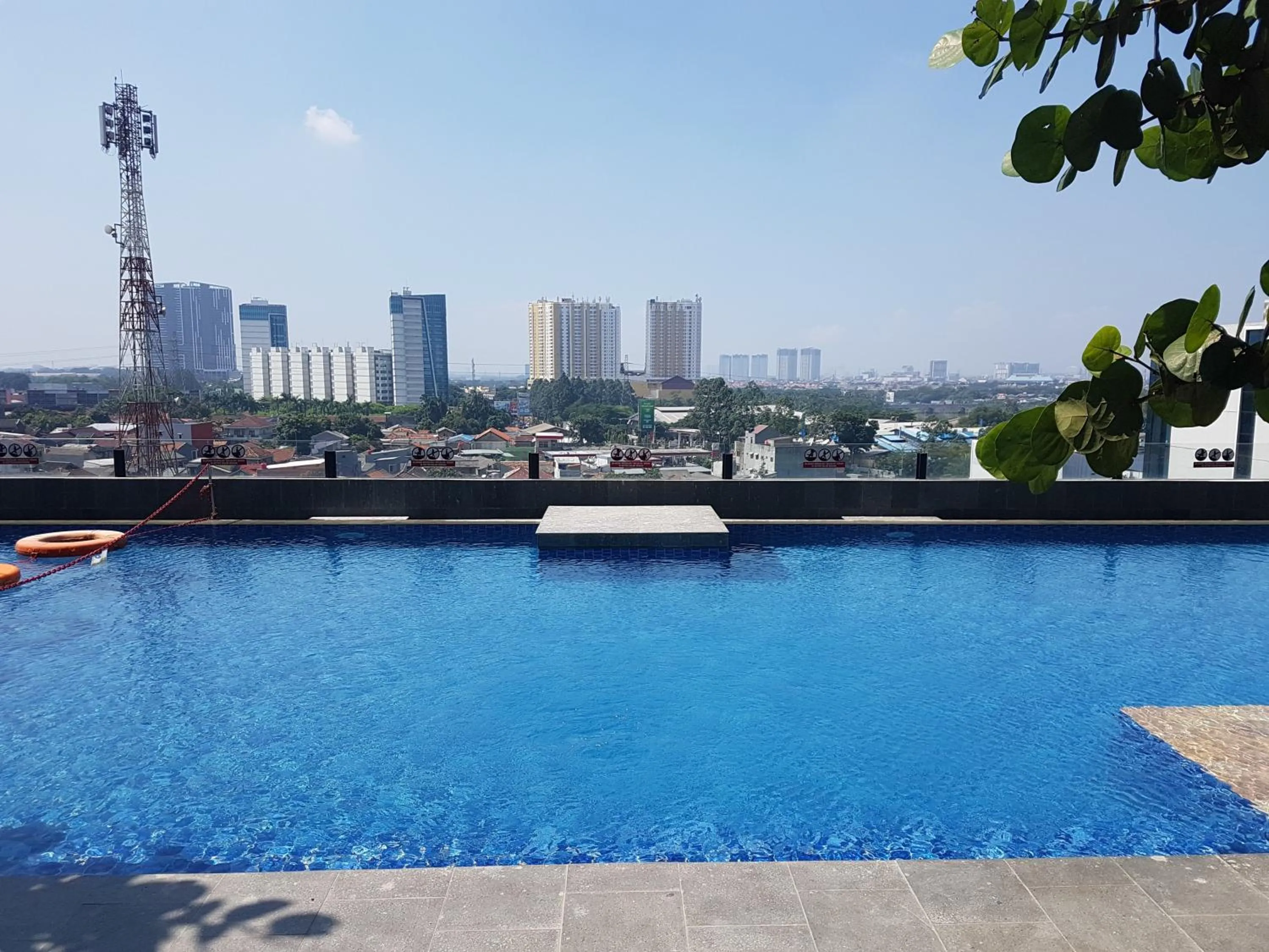 Swimming pool in Modern Studio Apartment at Tree Park Cikokol By Travelio