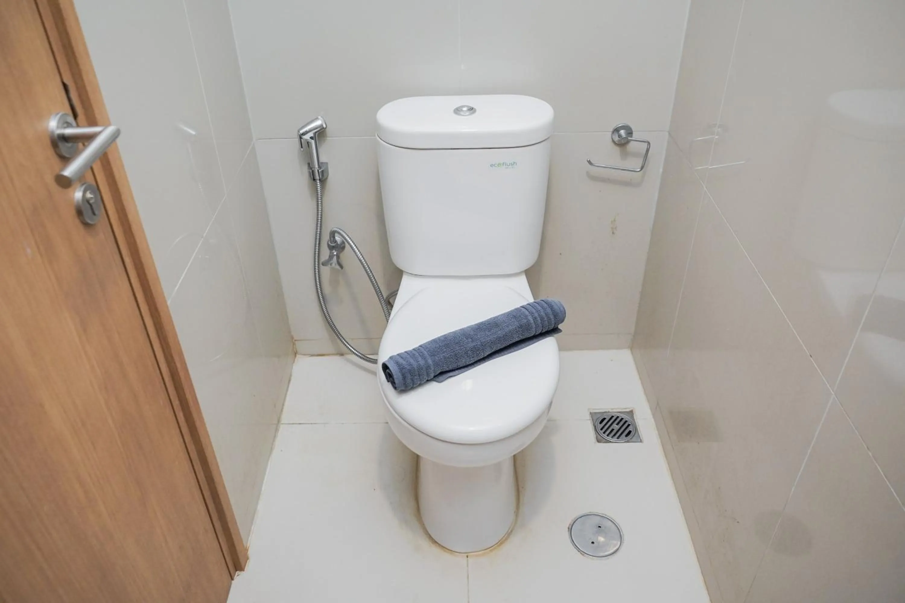 Bathroom in Modern Studio Apartment at Tree Park Cikokol By Travelio