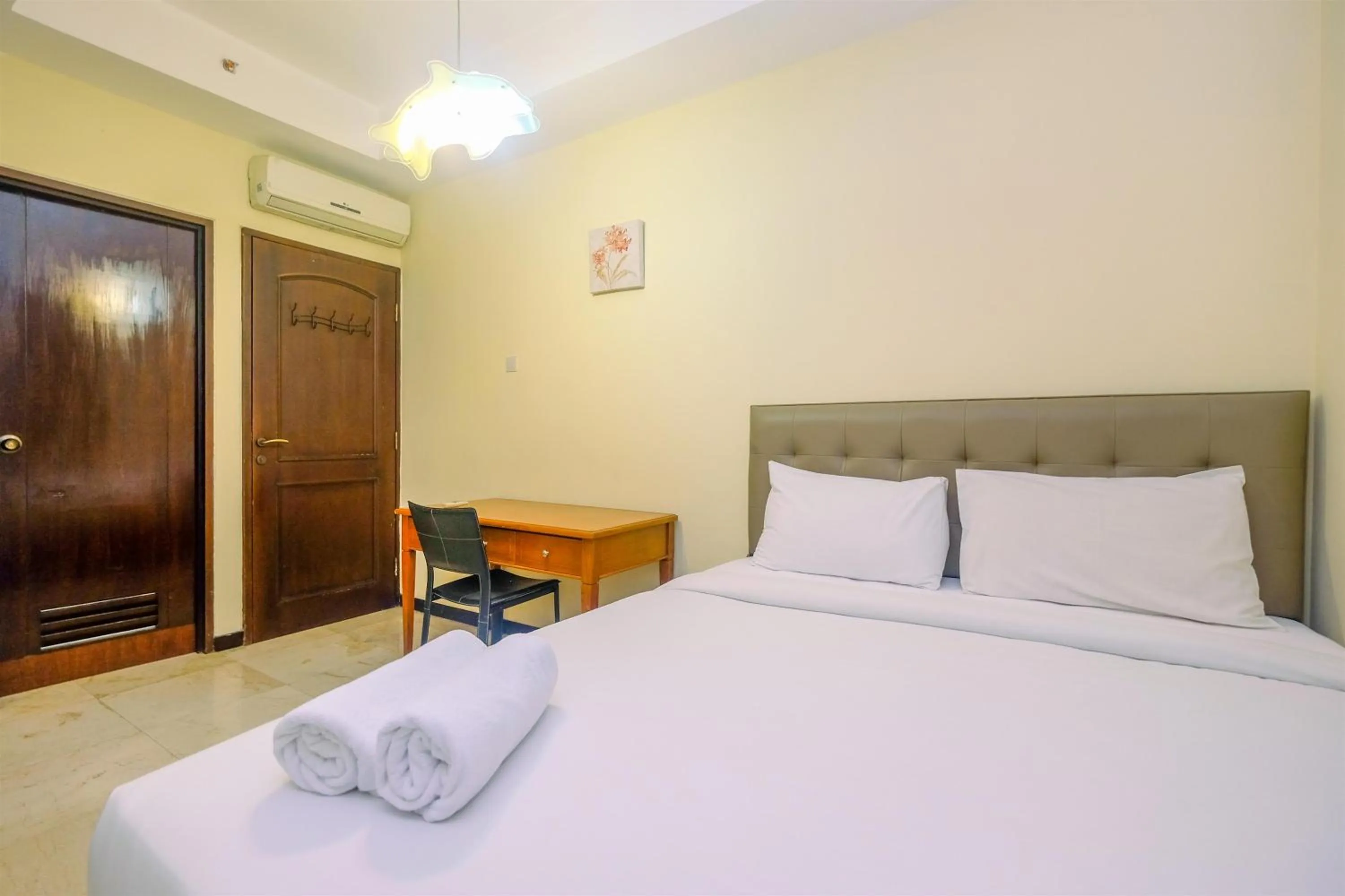 Bed in Exclusive with City View 3BR Apartment Bellagio Residence By Travelio