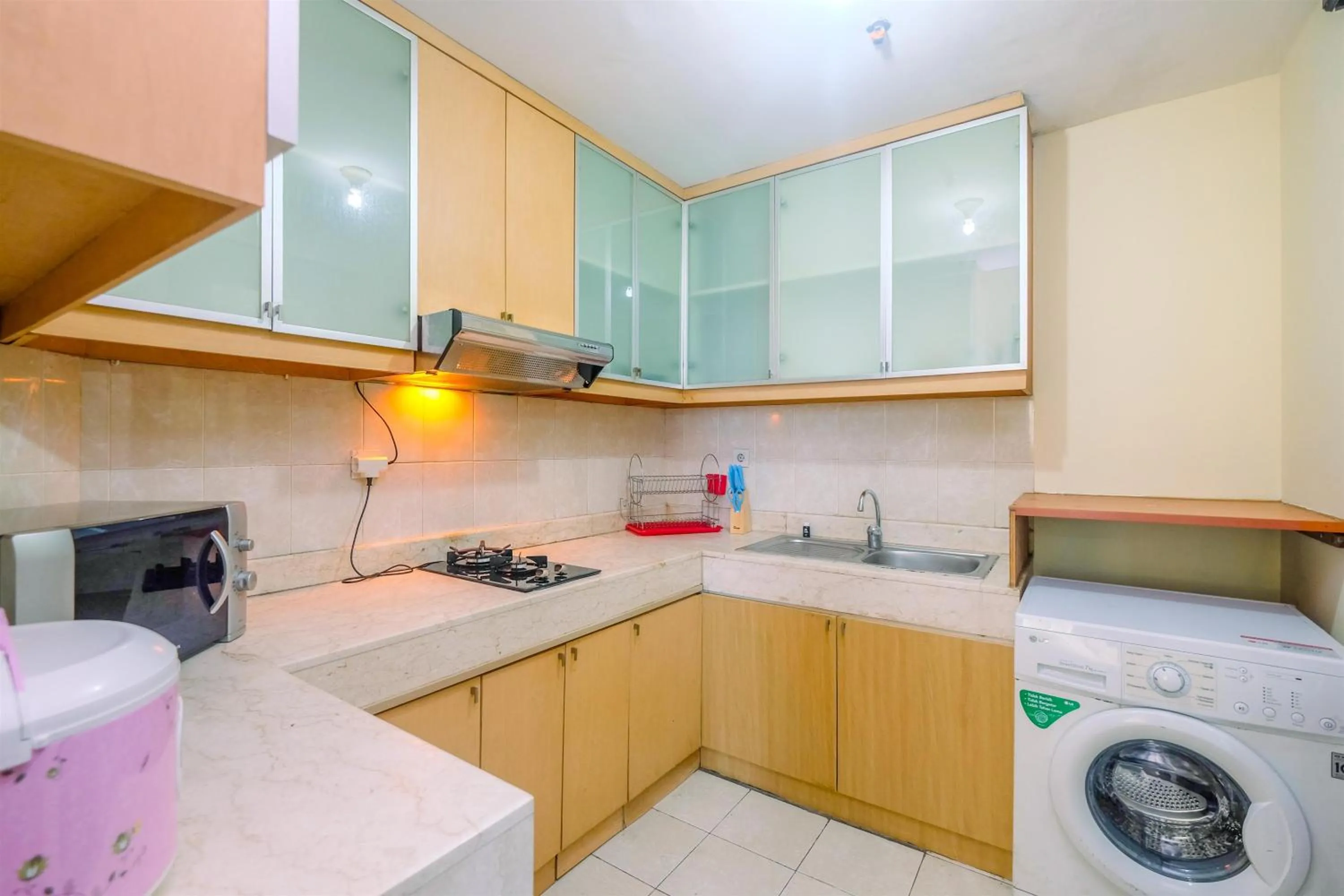 Kitchen or kitchenette in Exclusive with City View 3BR Apartment Bellagio Residence By Travelio