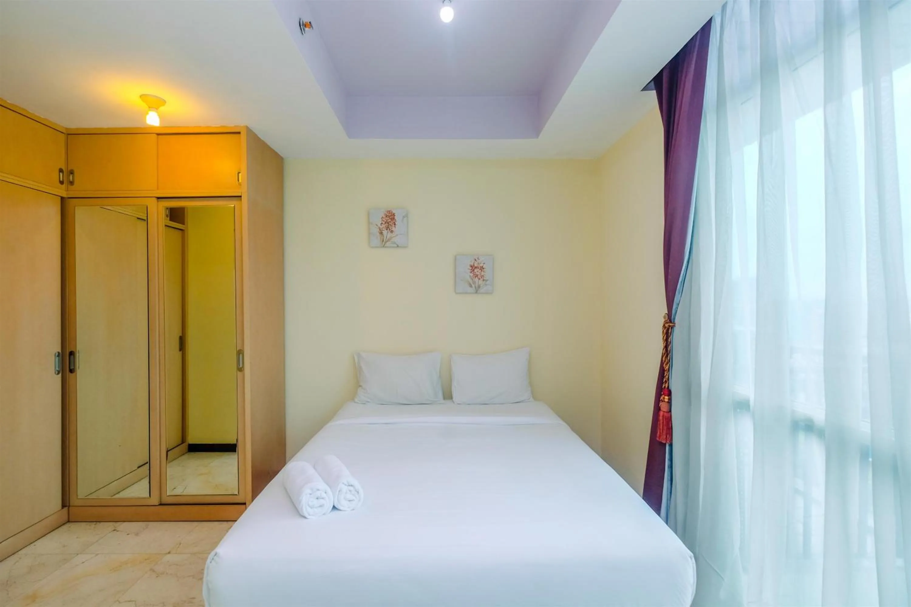 Bed in Exclusive with City View 3BR Apartment Bellagio Residence By Travelio