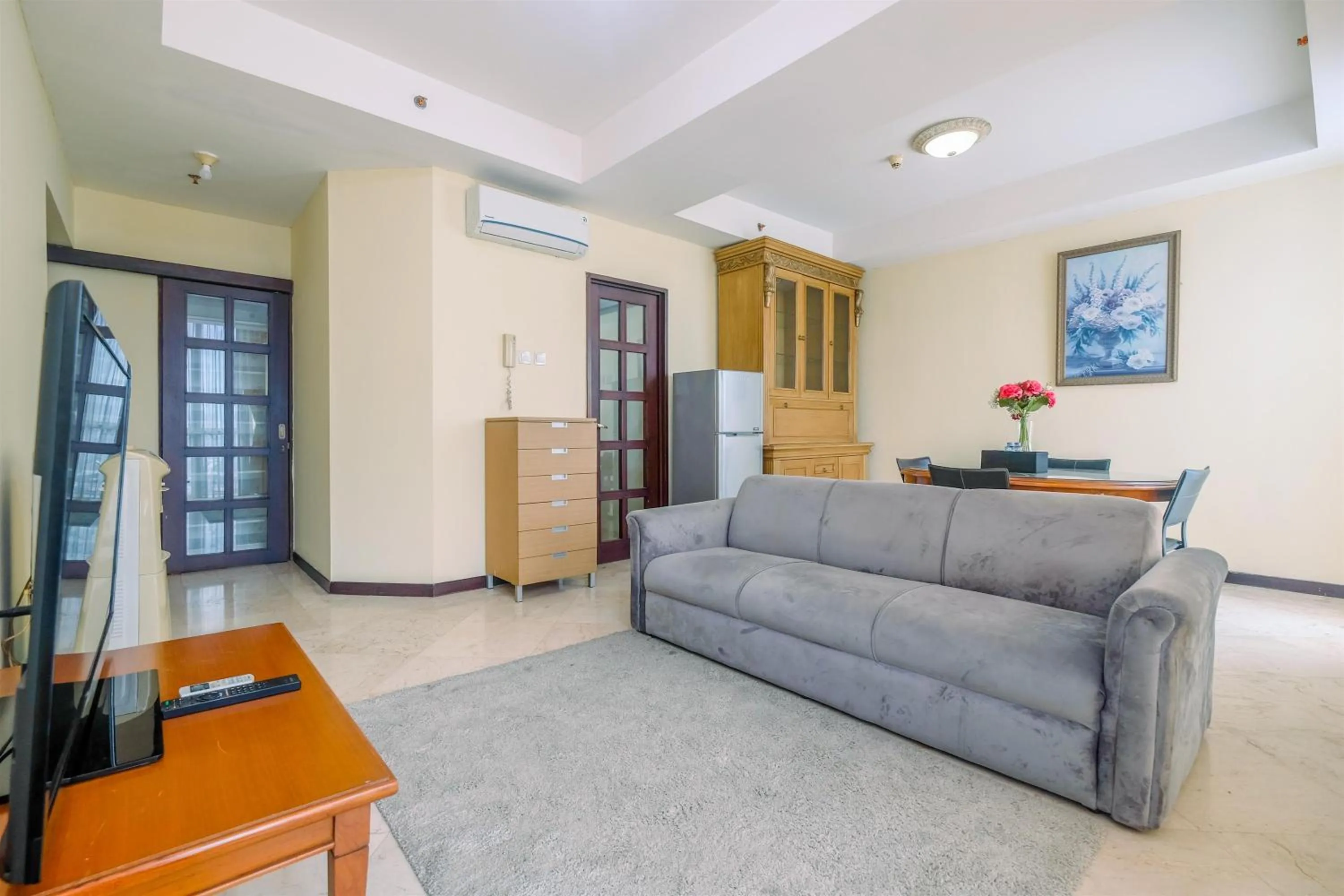 Living room in Exclusive with City View 3BR Apartment Bellagio Residence By Travelio