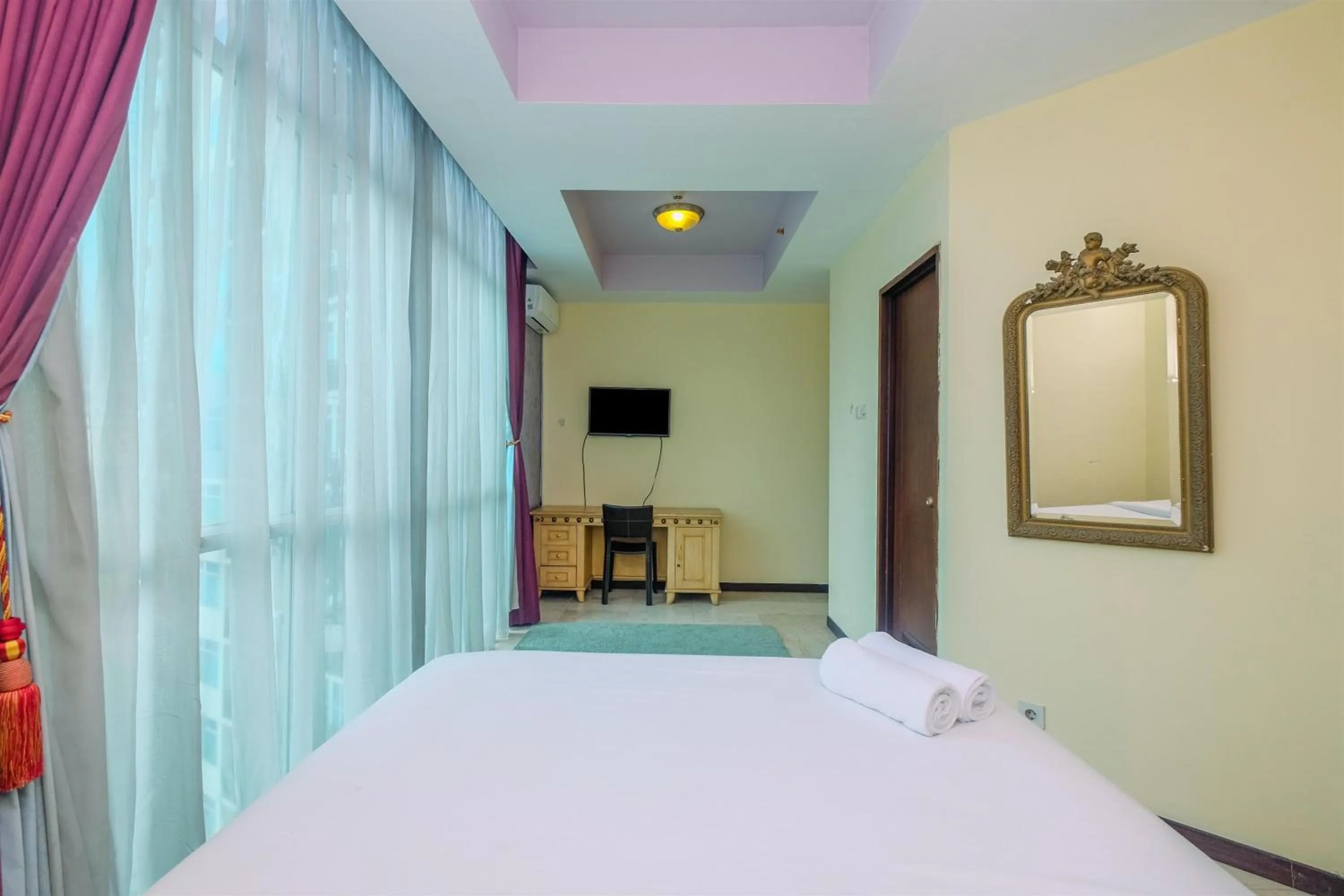 Bed in Exclusive with City View 3BR Apartment Bellagio Residence By Travelio