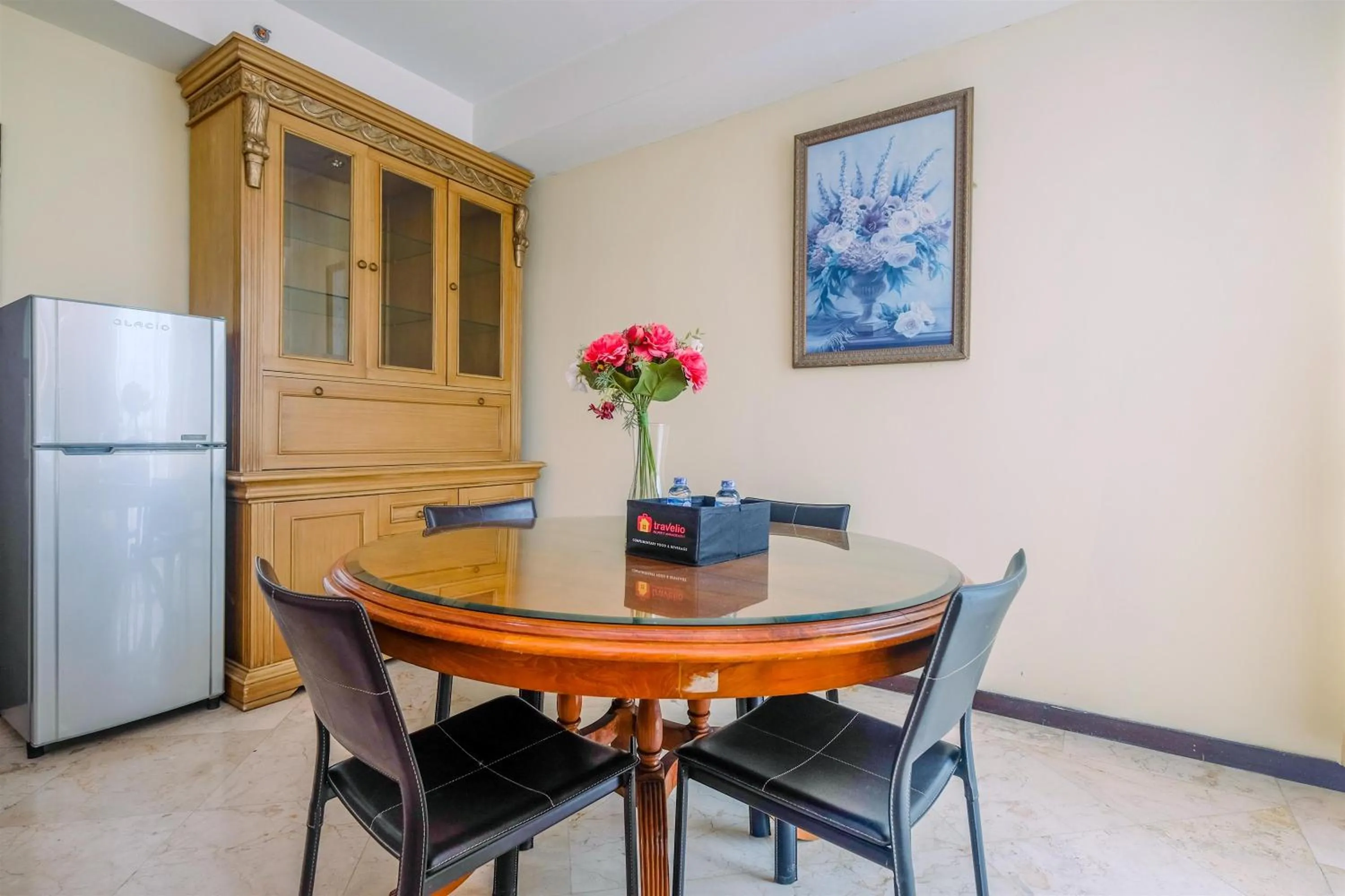 Dining area in Exclusive with City View 3BR Apartment Bellagio Residence By Travelio