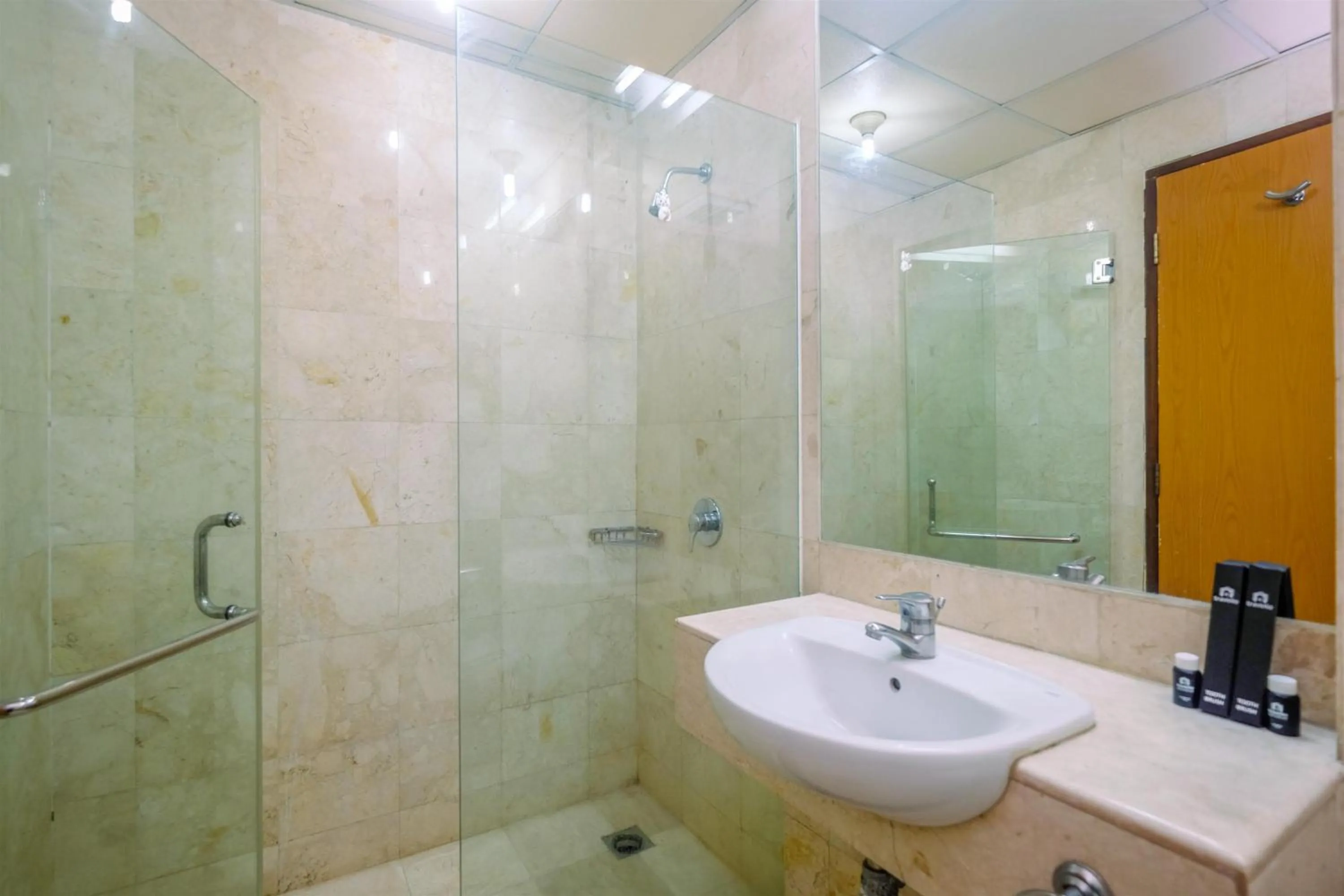 Bathroom in Exclusive with City View 3BR Apartment Bellagio Residence By Travelio
