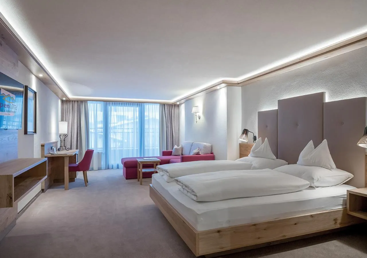 Bed in Hotel Alpenland