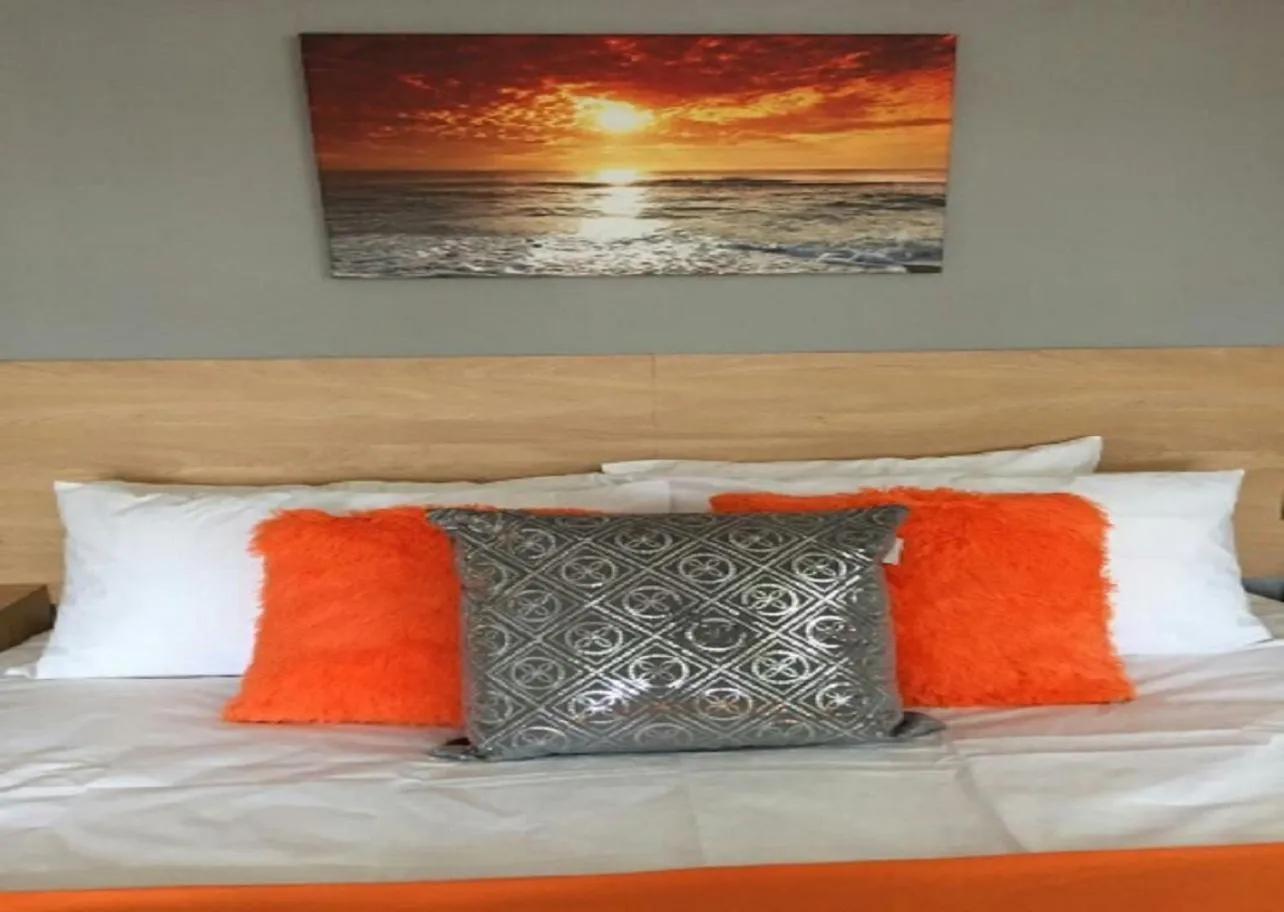 Bed in The Beaucliffe Hotel