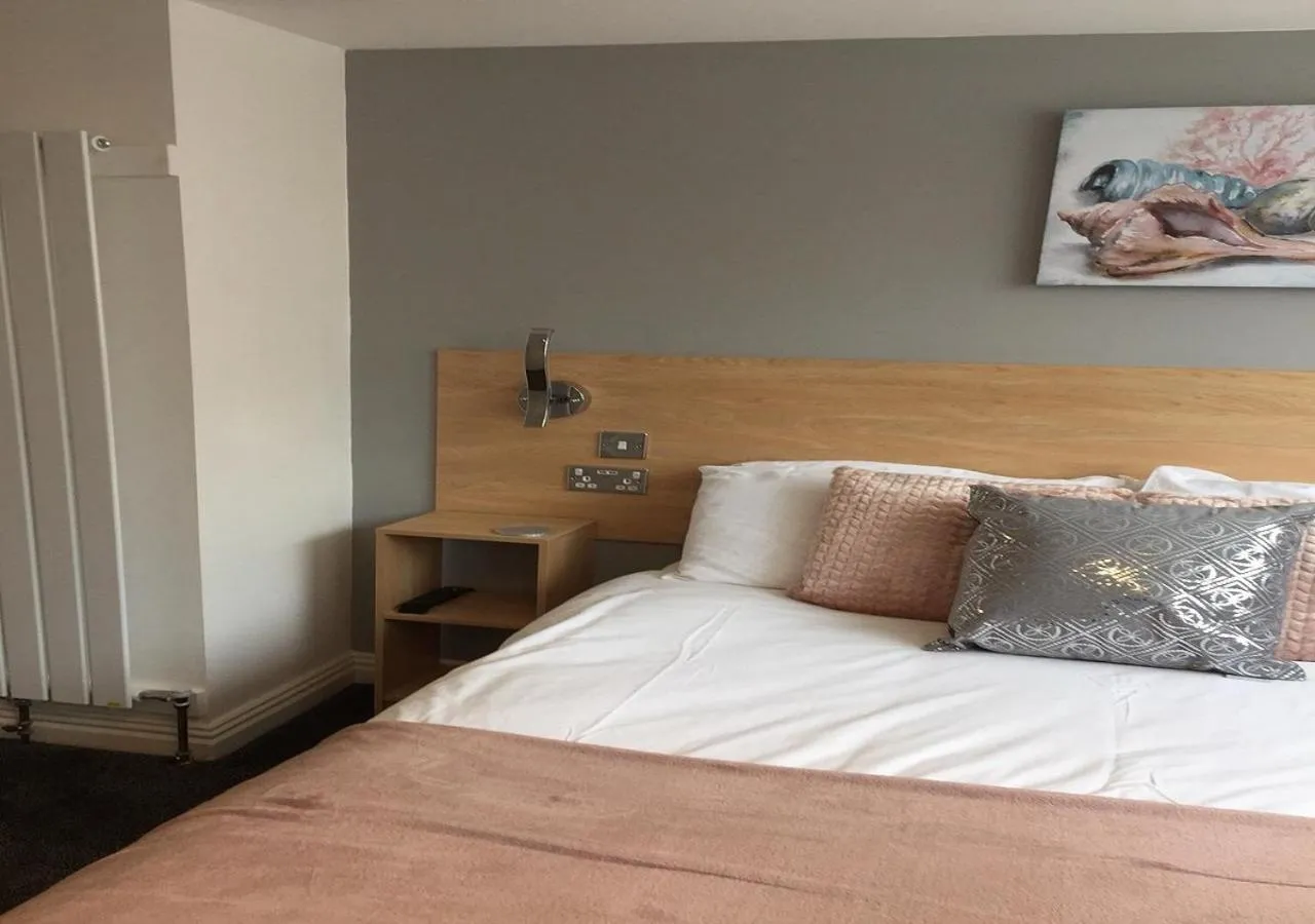 Bed in The Beaucliffe Hotel