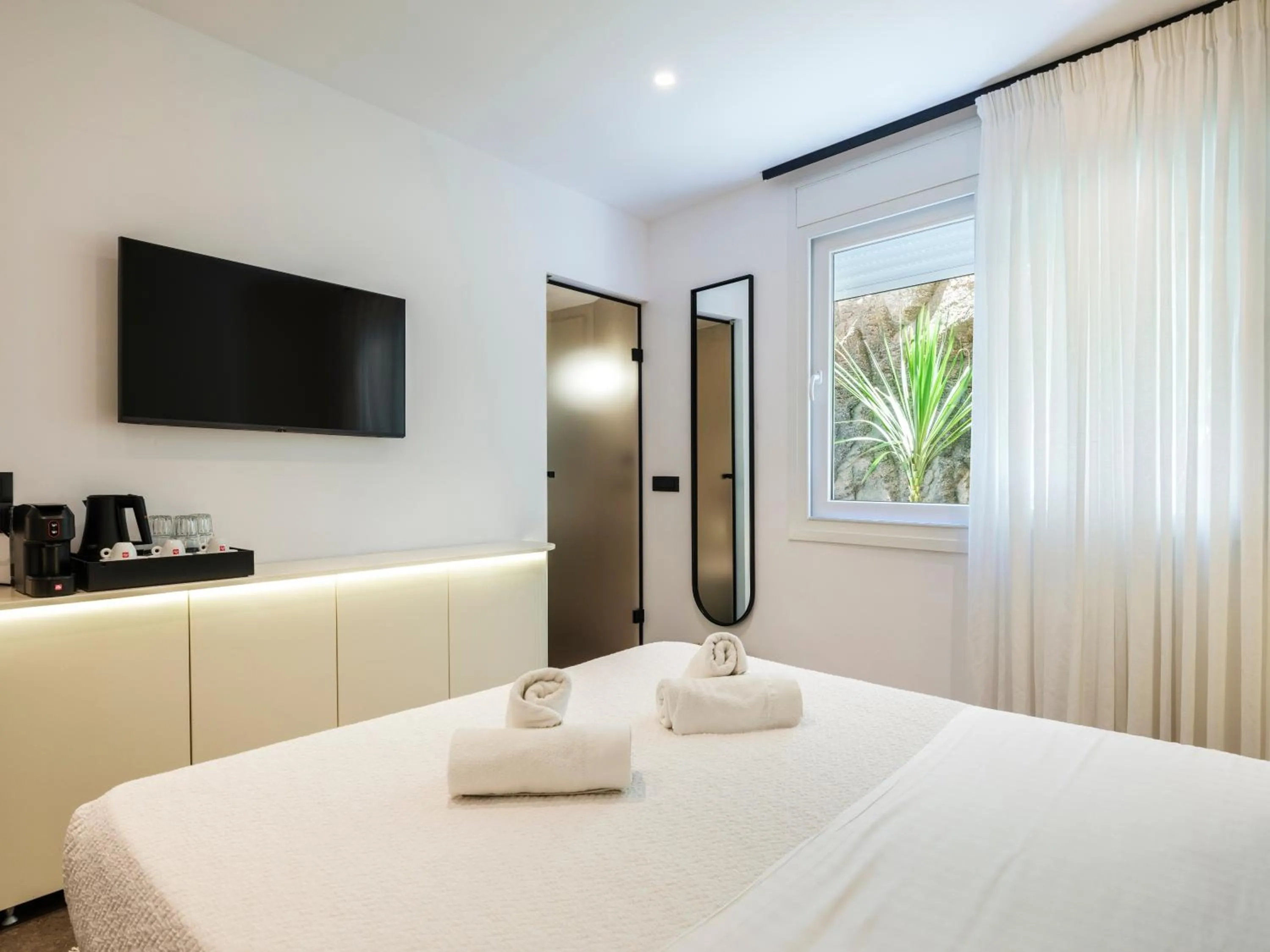 Bed in Yalos Hotel Sunset view Mykonos town private rooms