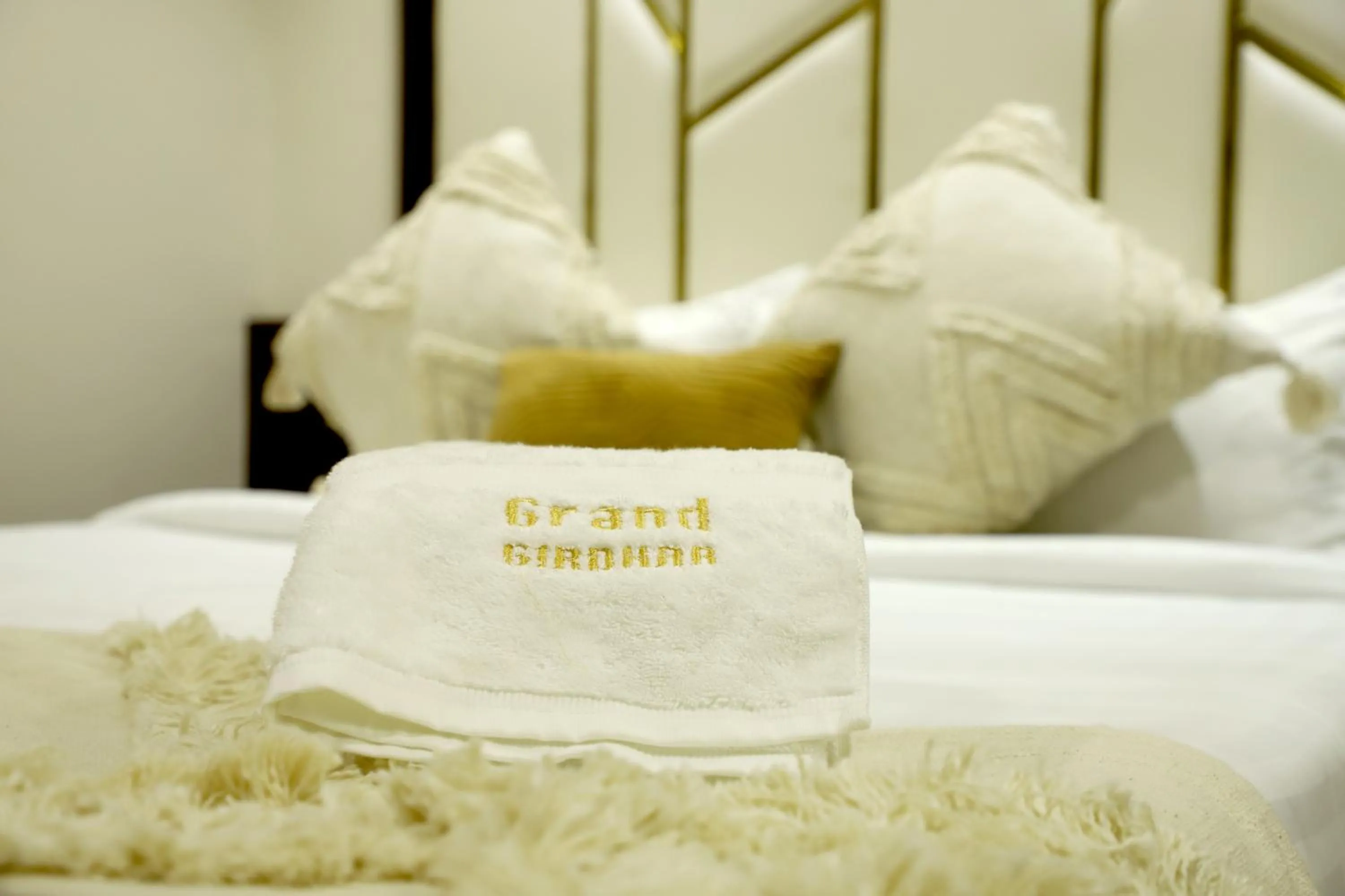 Property logo or sign, Bed in Hotel Grand Girdhar