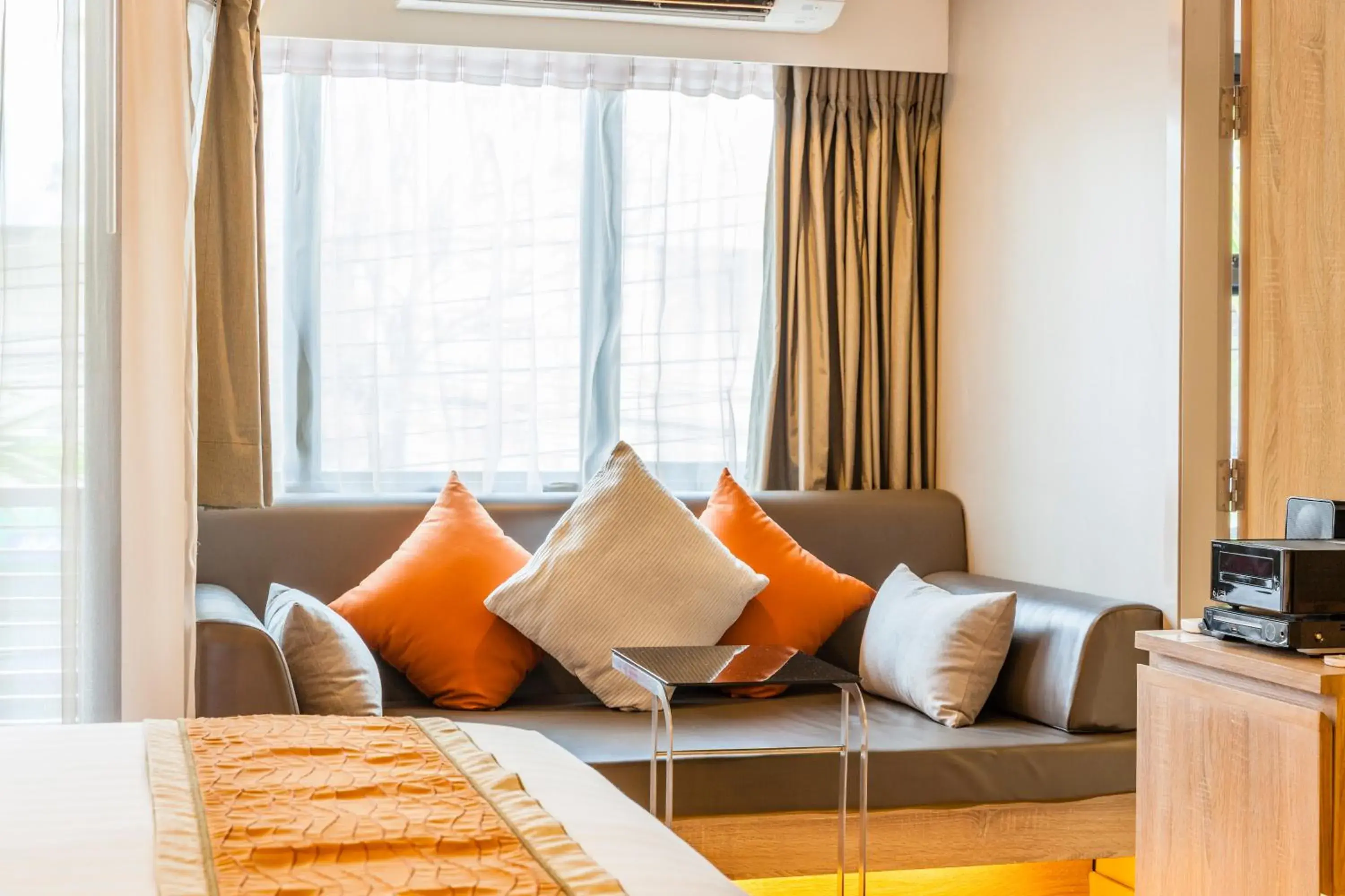 Seating area, Bed in Pacific Park Hotel Seating area, Bed in Pacific Park Hotel