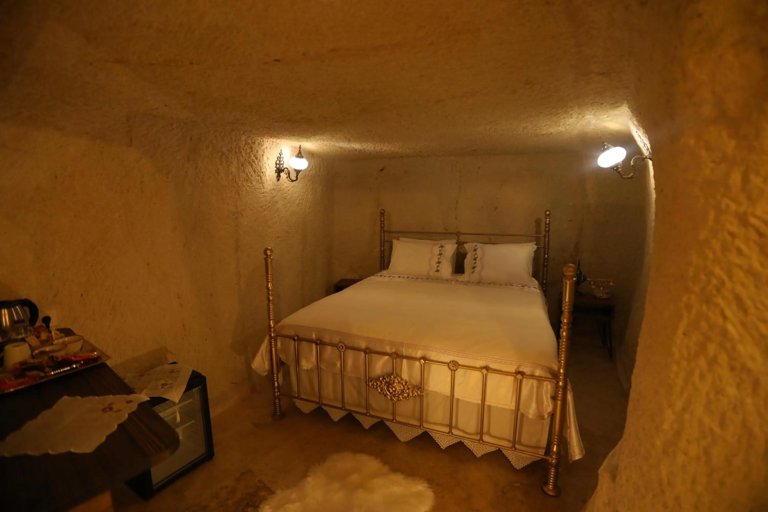Bed in Hancı Cave Hotel