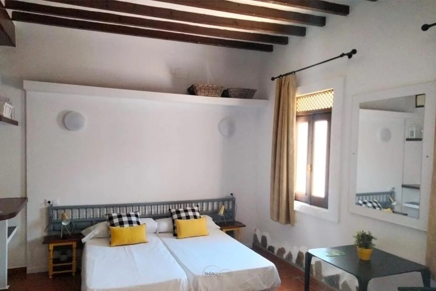 Bed in Hostal León Dormido