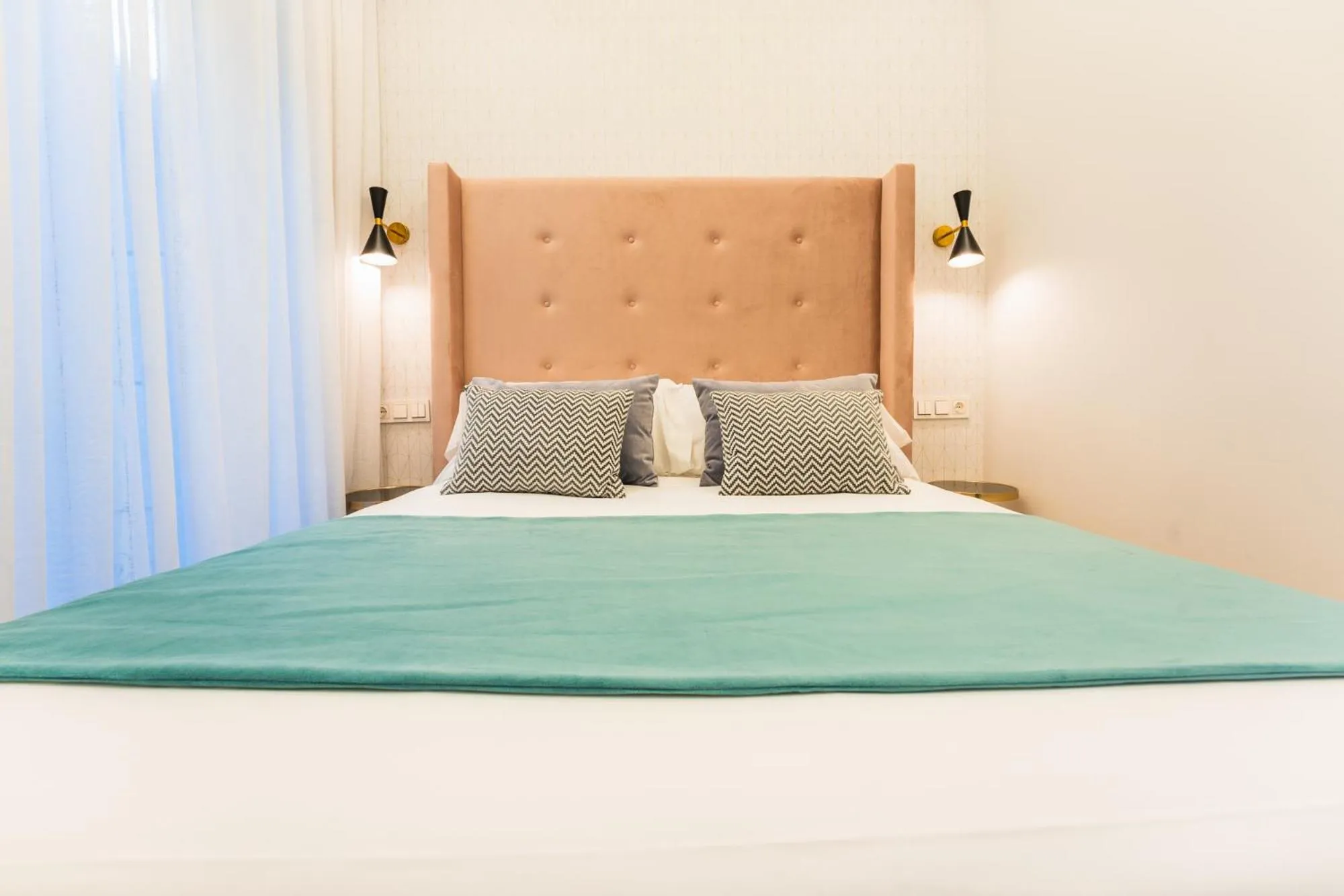 Bed in Debambú Suites