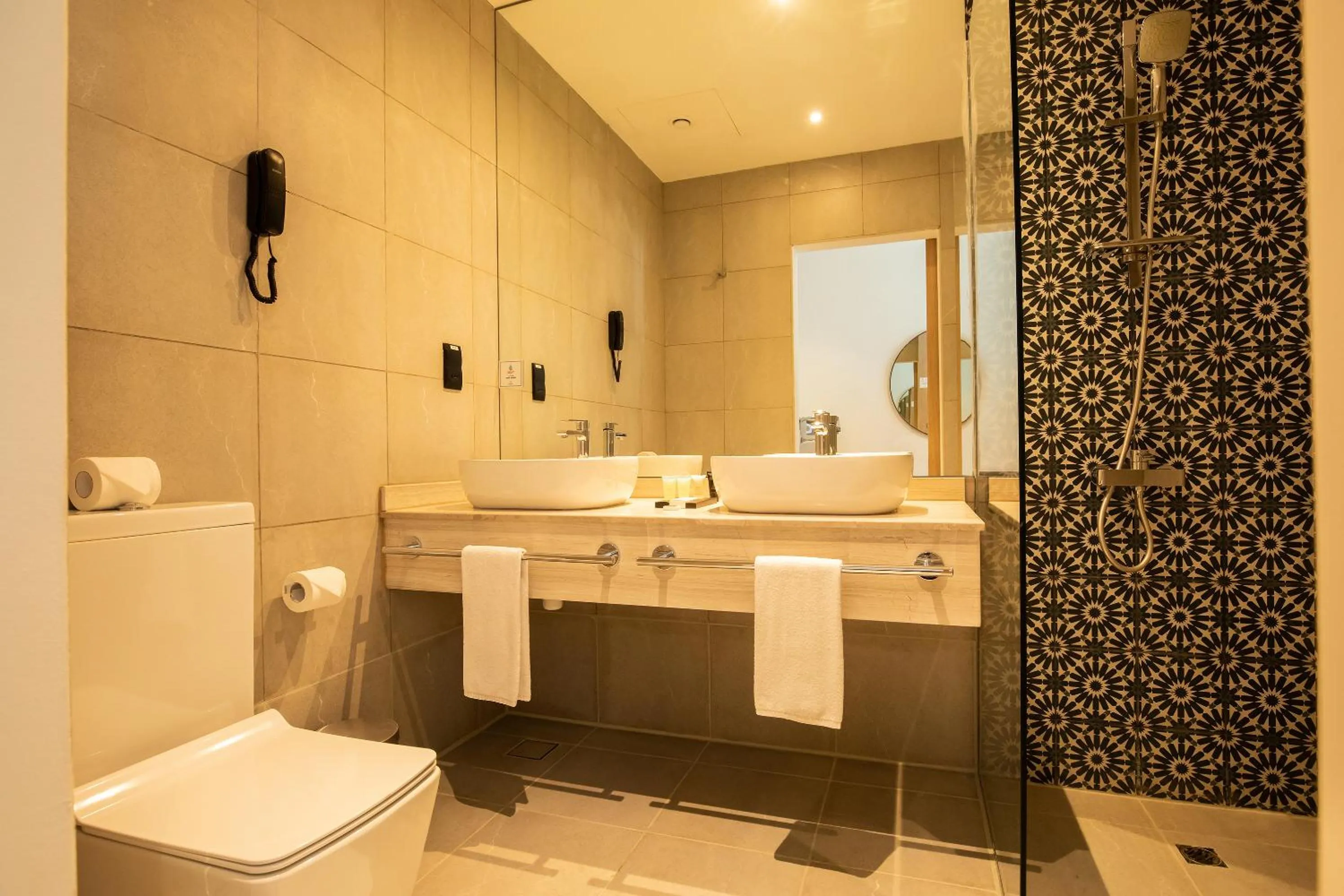 Bathroom in Grand Kingsgate Jaddaf Waterfront Hotel by Millennium