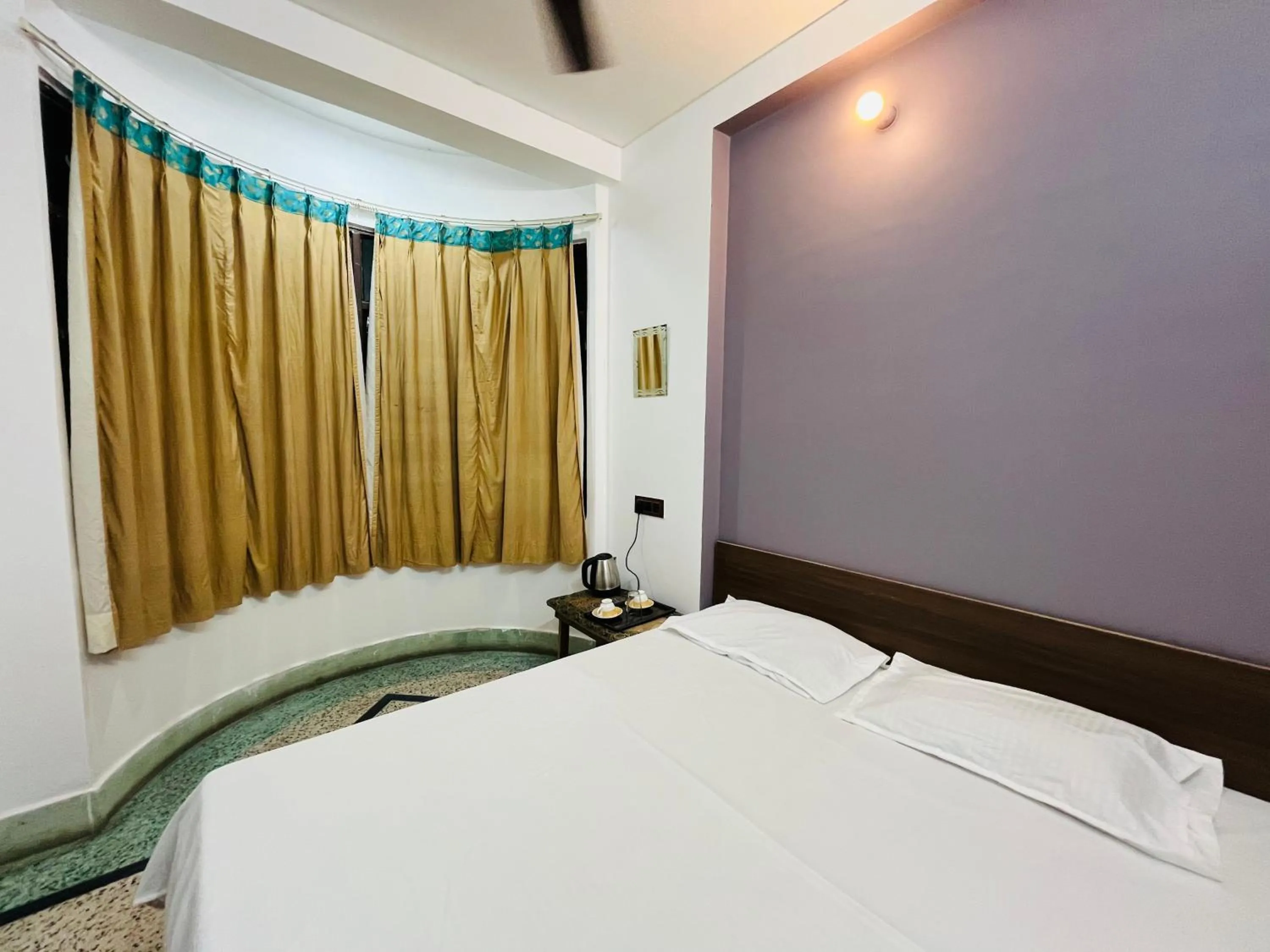 Photo of the whole room, Bed in Ganga Guest House