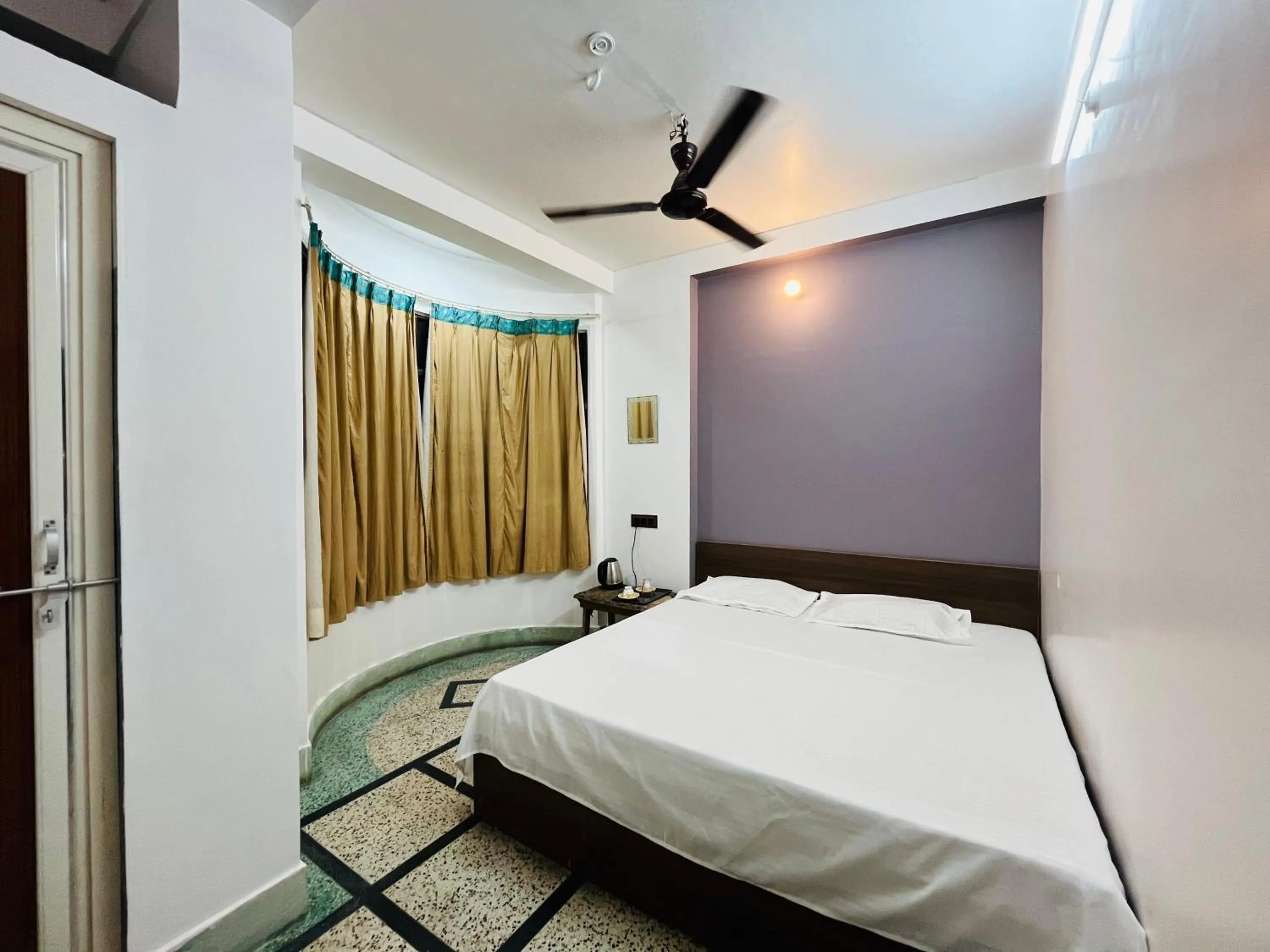 Photo of the whole room, Bed in Ganga Guest House