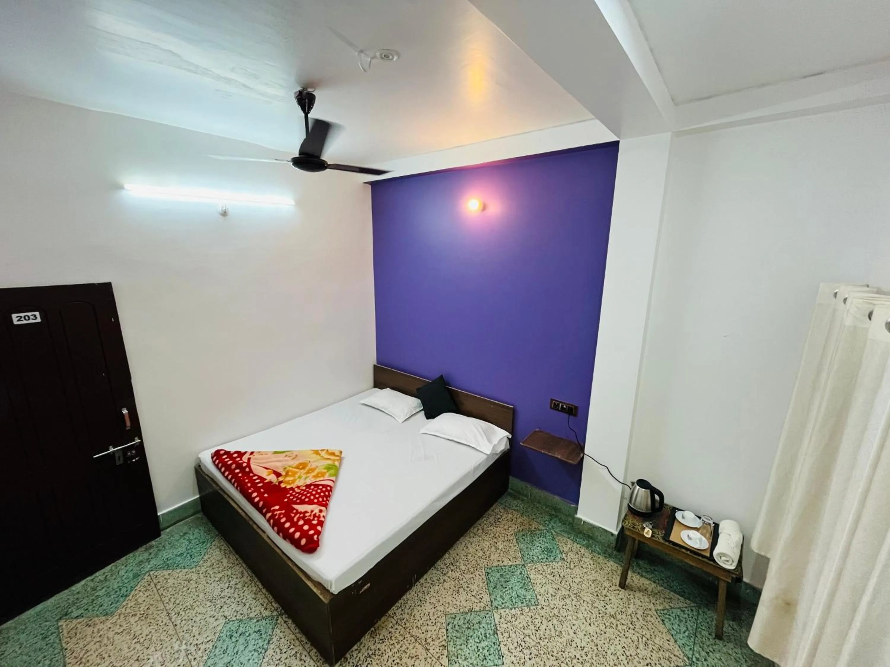 Photo of the whole room, Bed in Ganga Guest House