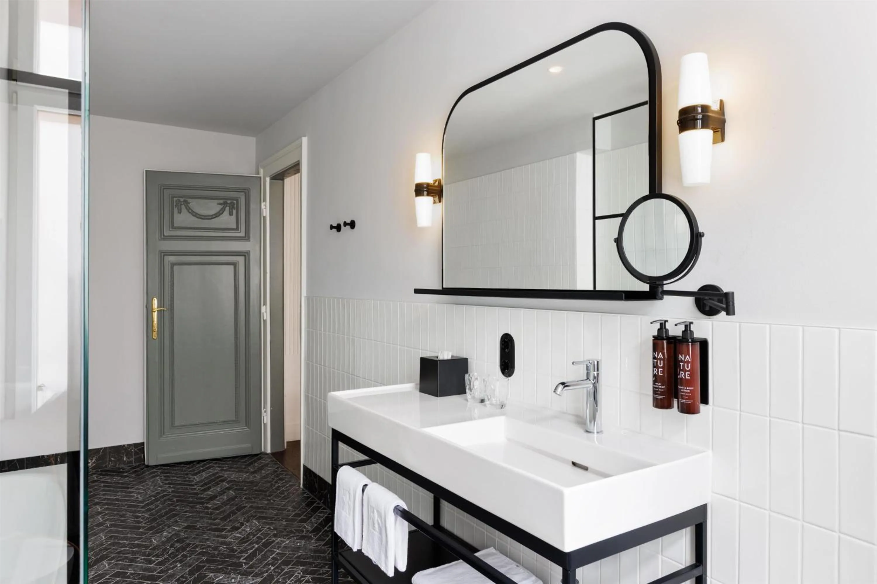 Bathroom in Hotel Astoria Vienna, Curio Collection by Hilton