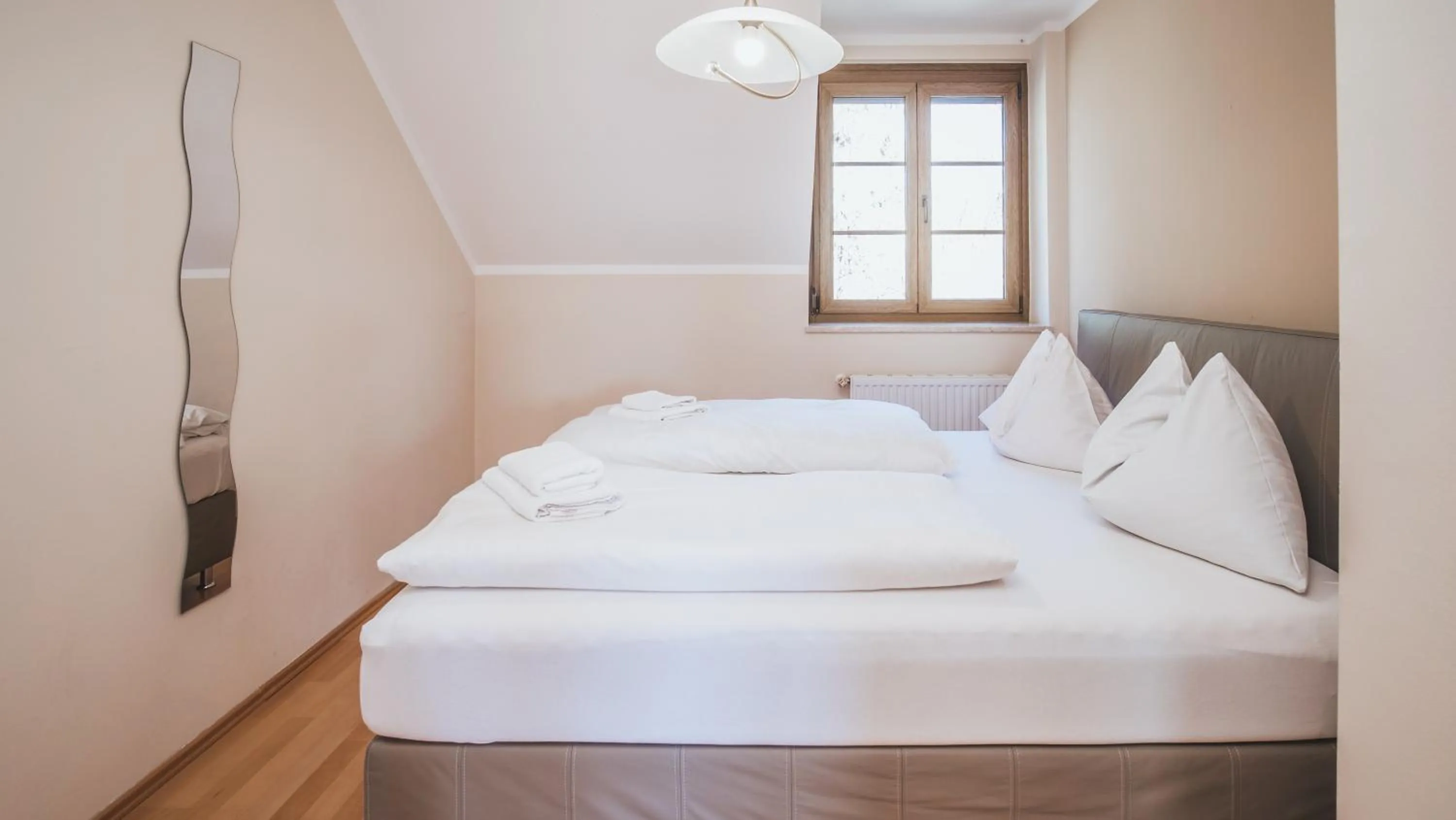 Bedroom, Bed in Hotel Kärntnerhof Velden by S4Y