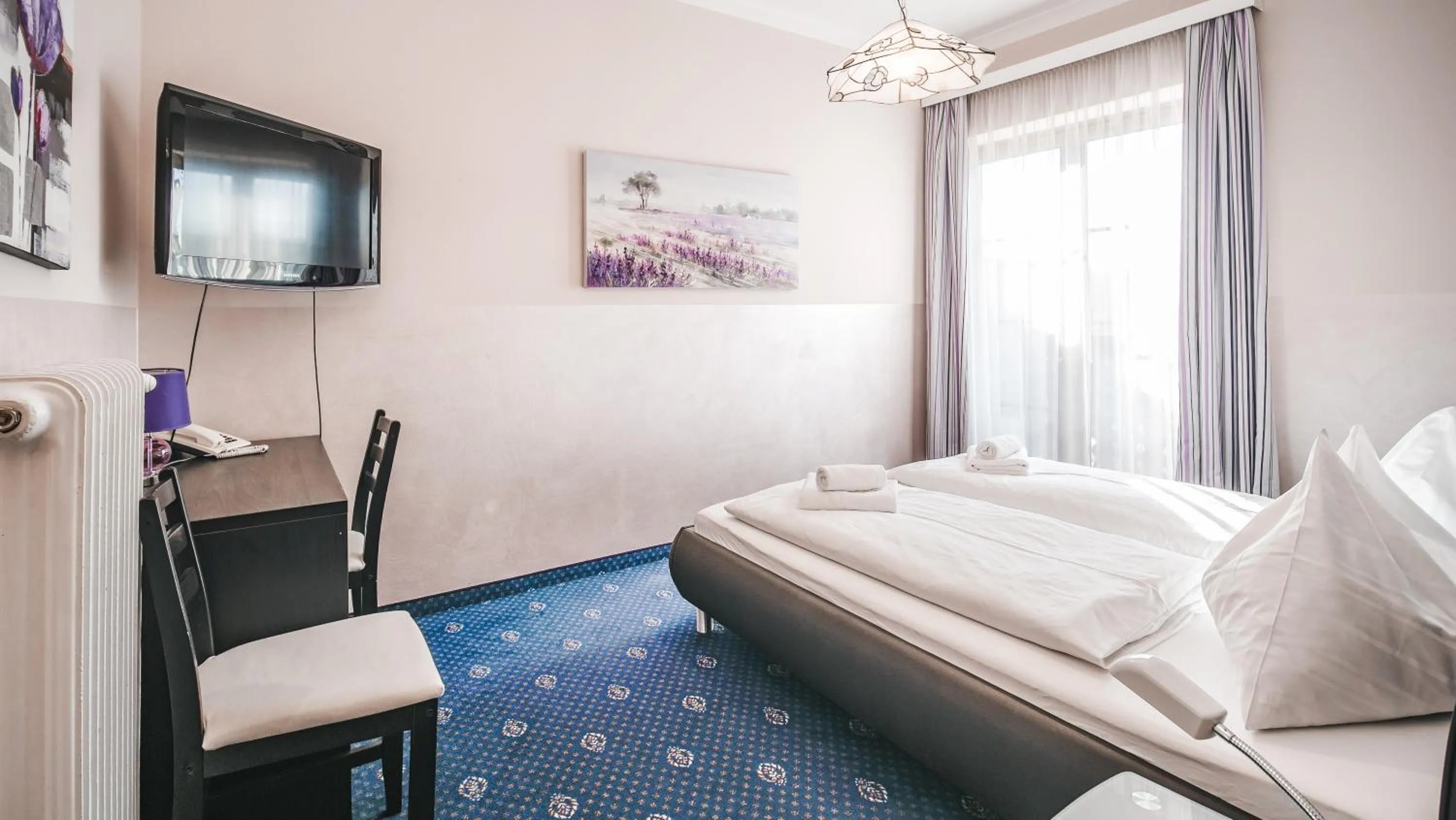 Bedroom, Bed in Hotel Kärntnerhof Velden by S4Y