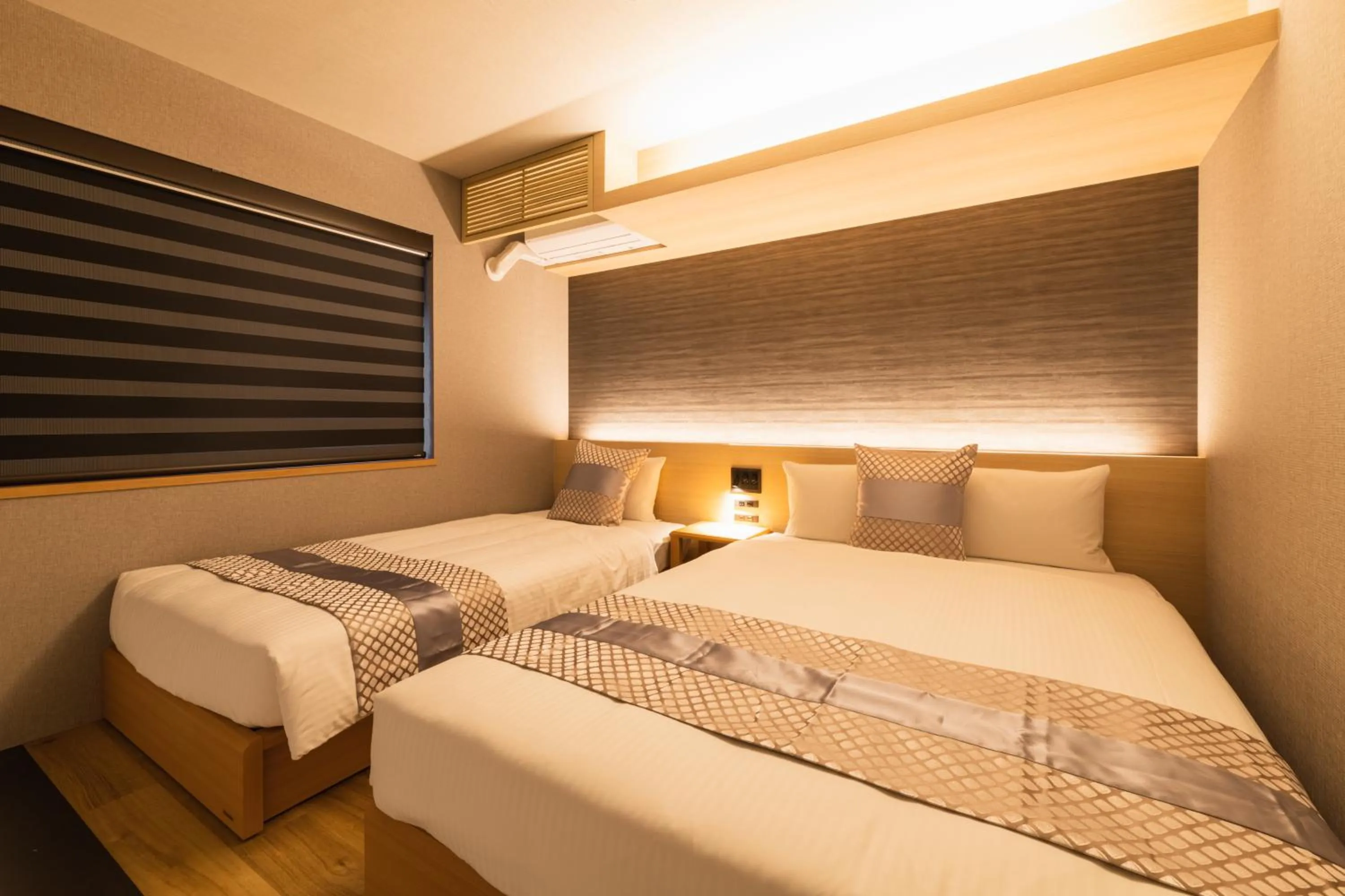 Bed in GRAND BASE Kagoshima Chuo