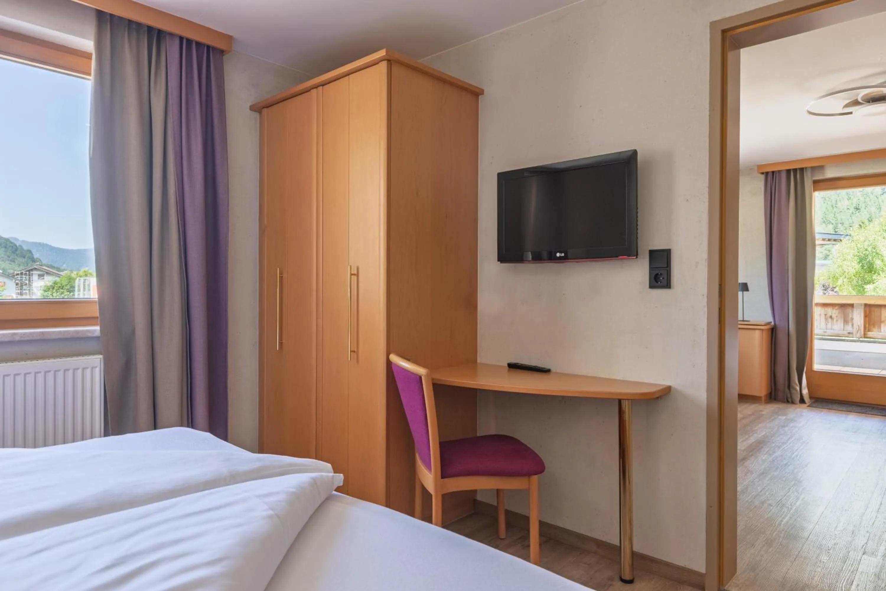 Seating area, Bed in Boutiquehotel Acherl