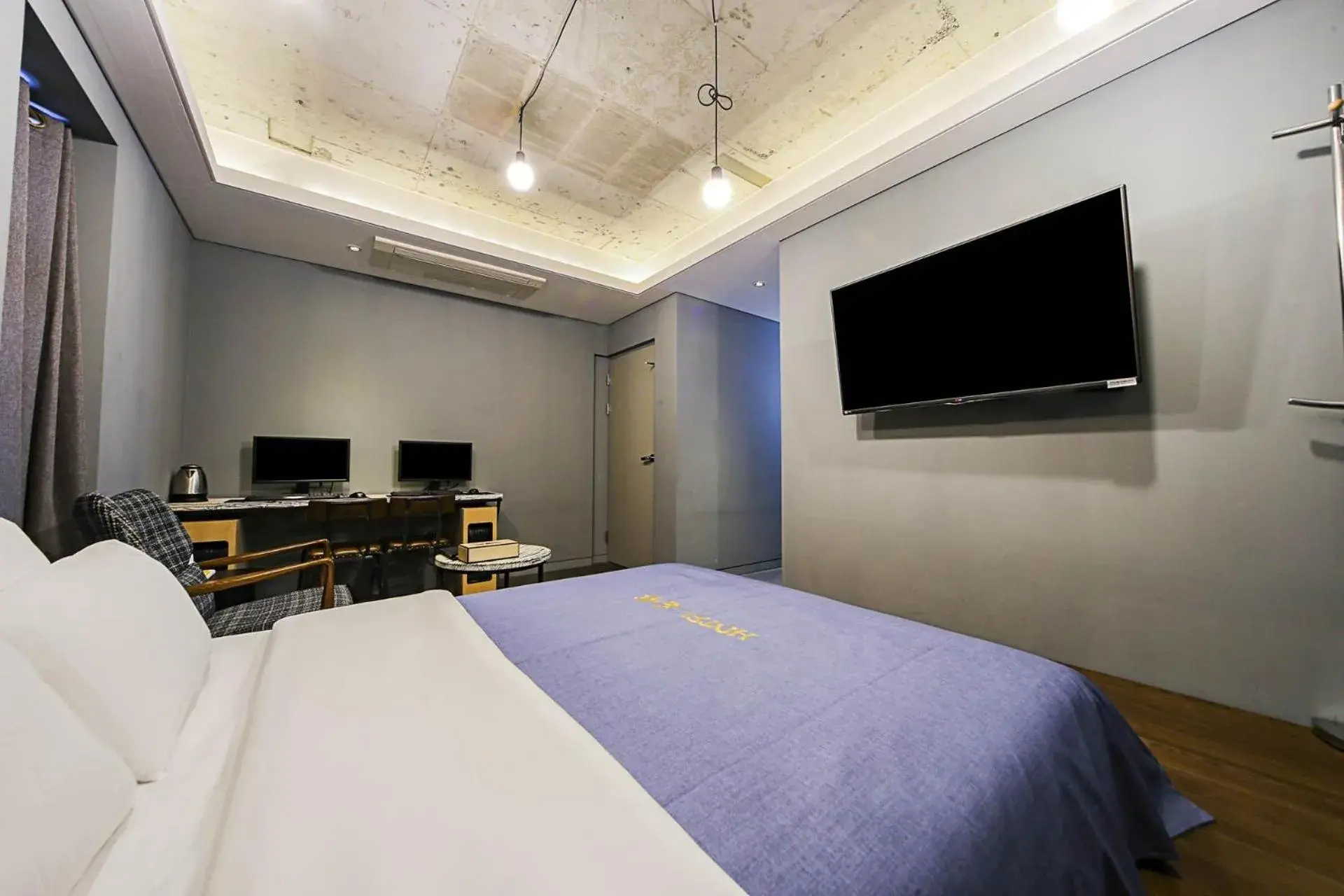 Communal lounge/ TV room, Bed in Hotel Myeongjak Communal lounge/ TV room, Bed in Hotel Myeongjak