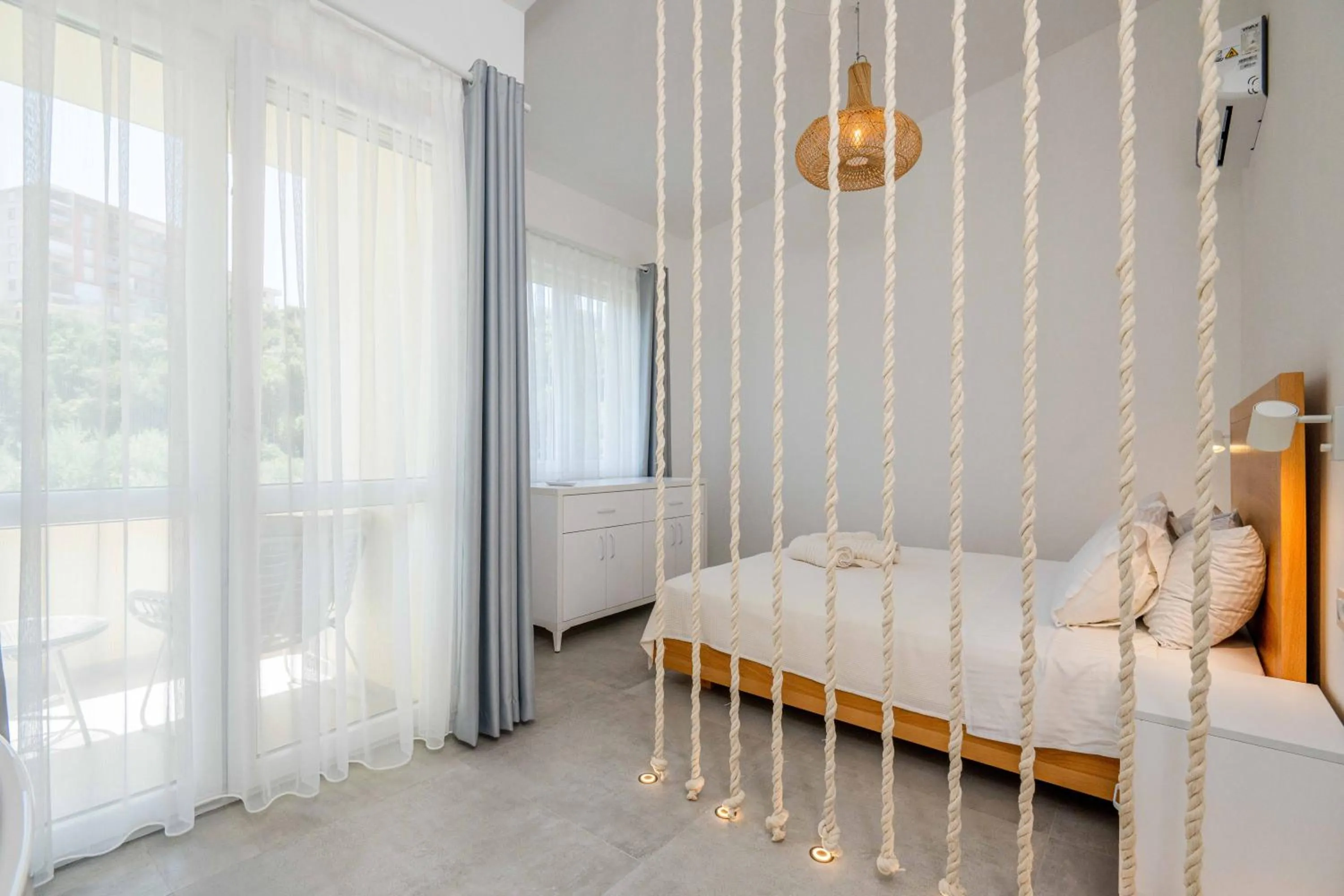 Bed in President Bungalows and Apartments