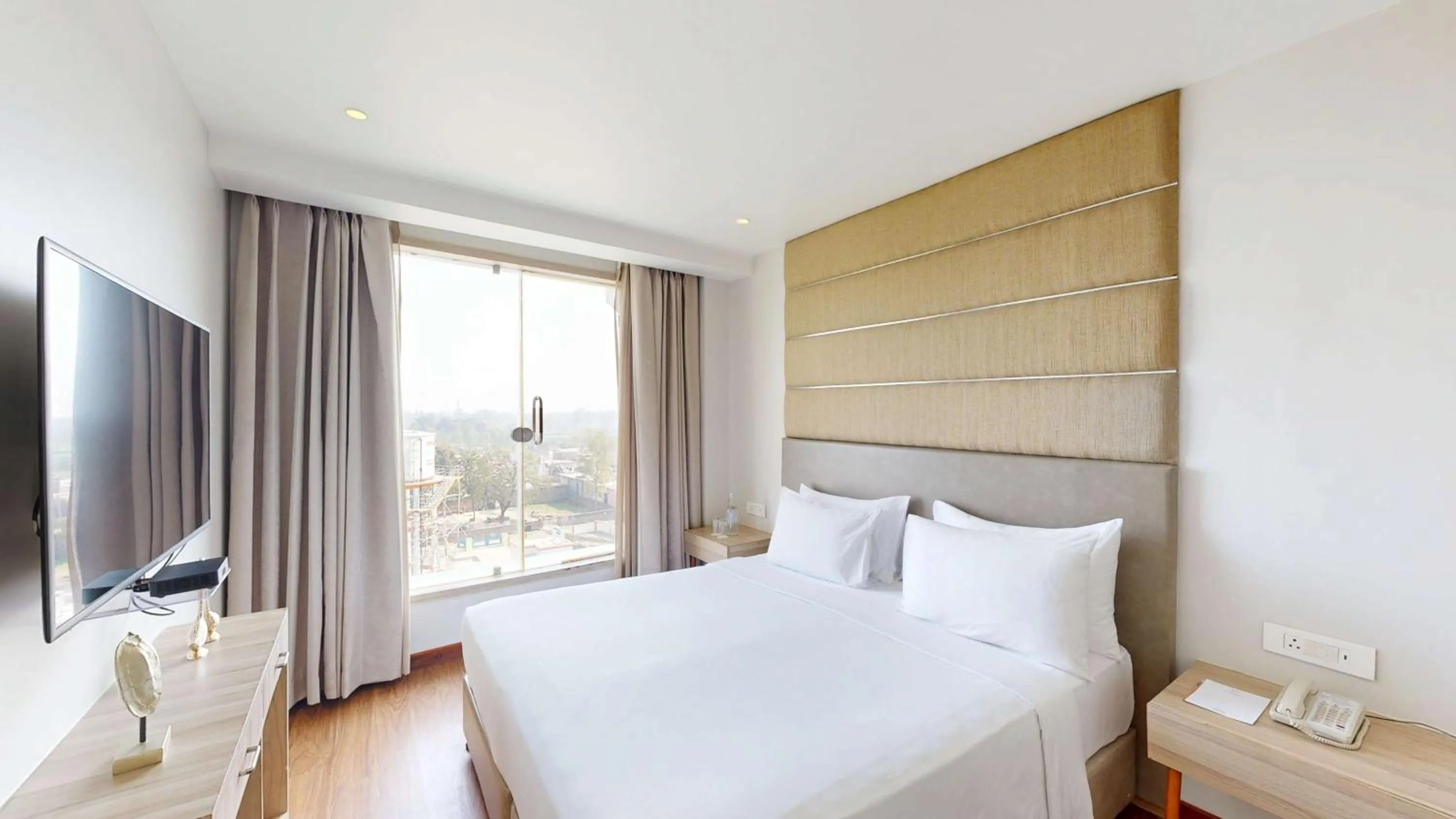 Photo of the whole room, Bed in Radisson Hotel Bareilly Airport