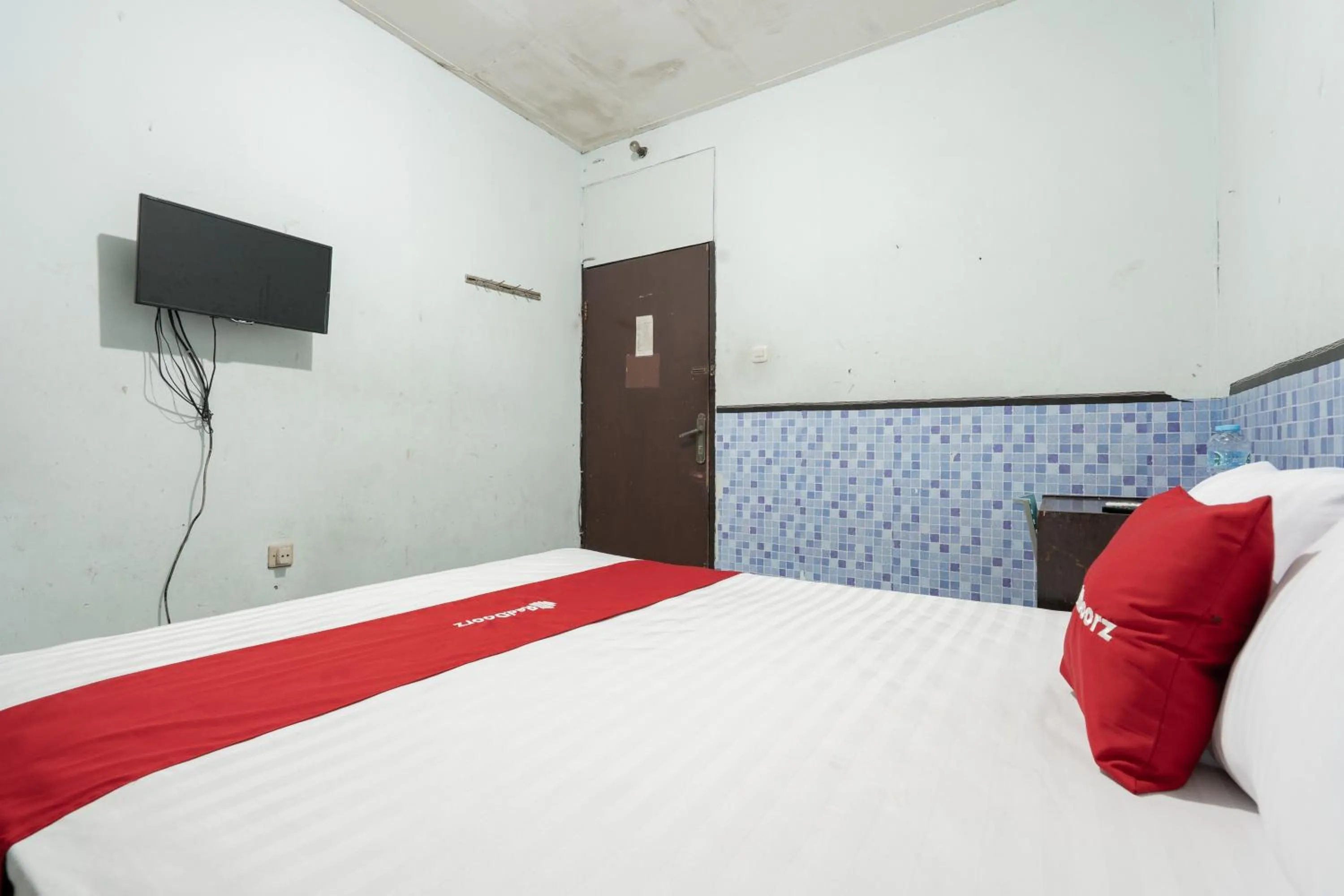 Bedroom, Bed in RedDoorz Syariah near Pasar Pagi Samarinda